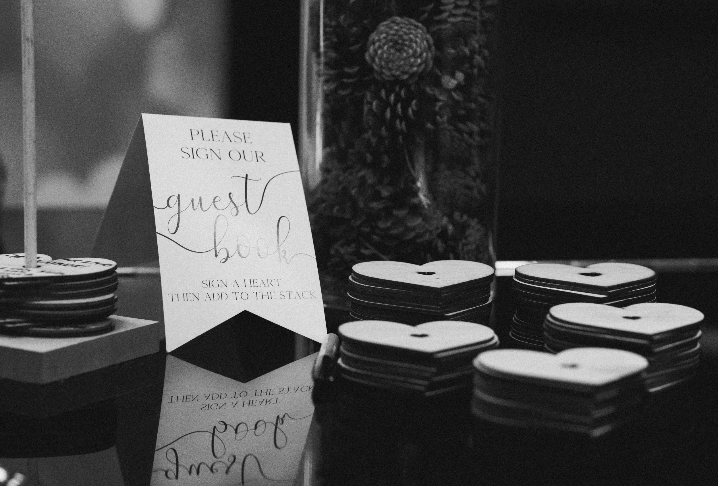 Wedding guest book and heart-shaped message cards at a Glasgow wedding reception