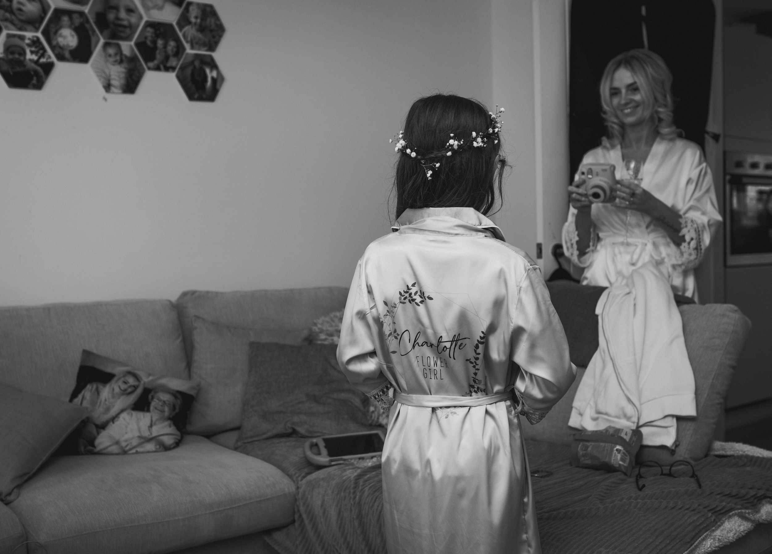 Flower girl and bride sharing a playful moment during wedding preparations
