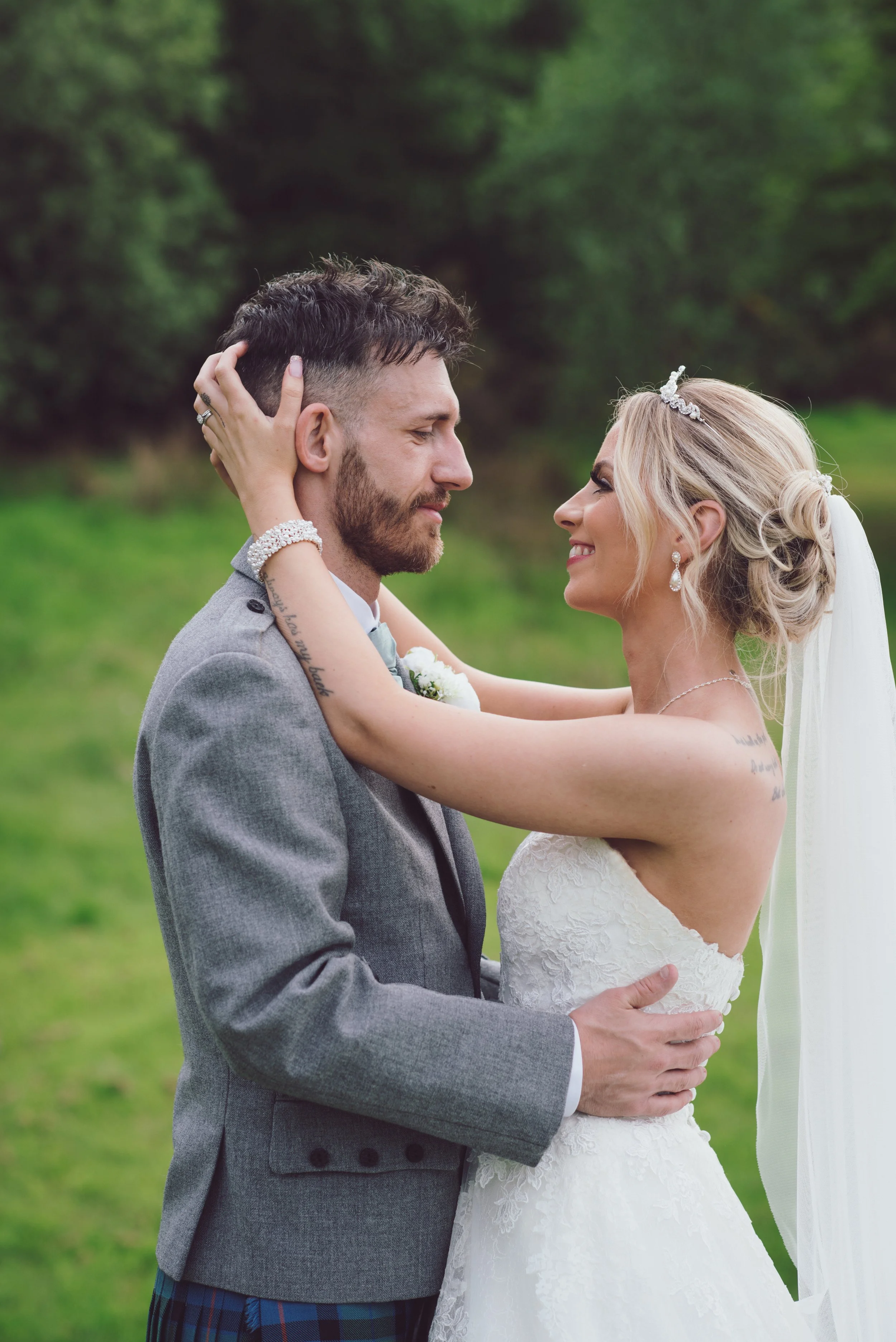 Bride and groom sharing a romantic moment together during their wedding portraits