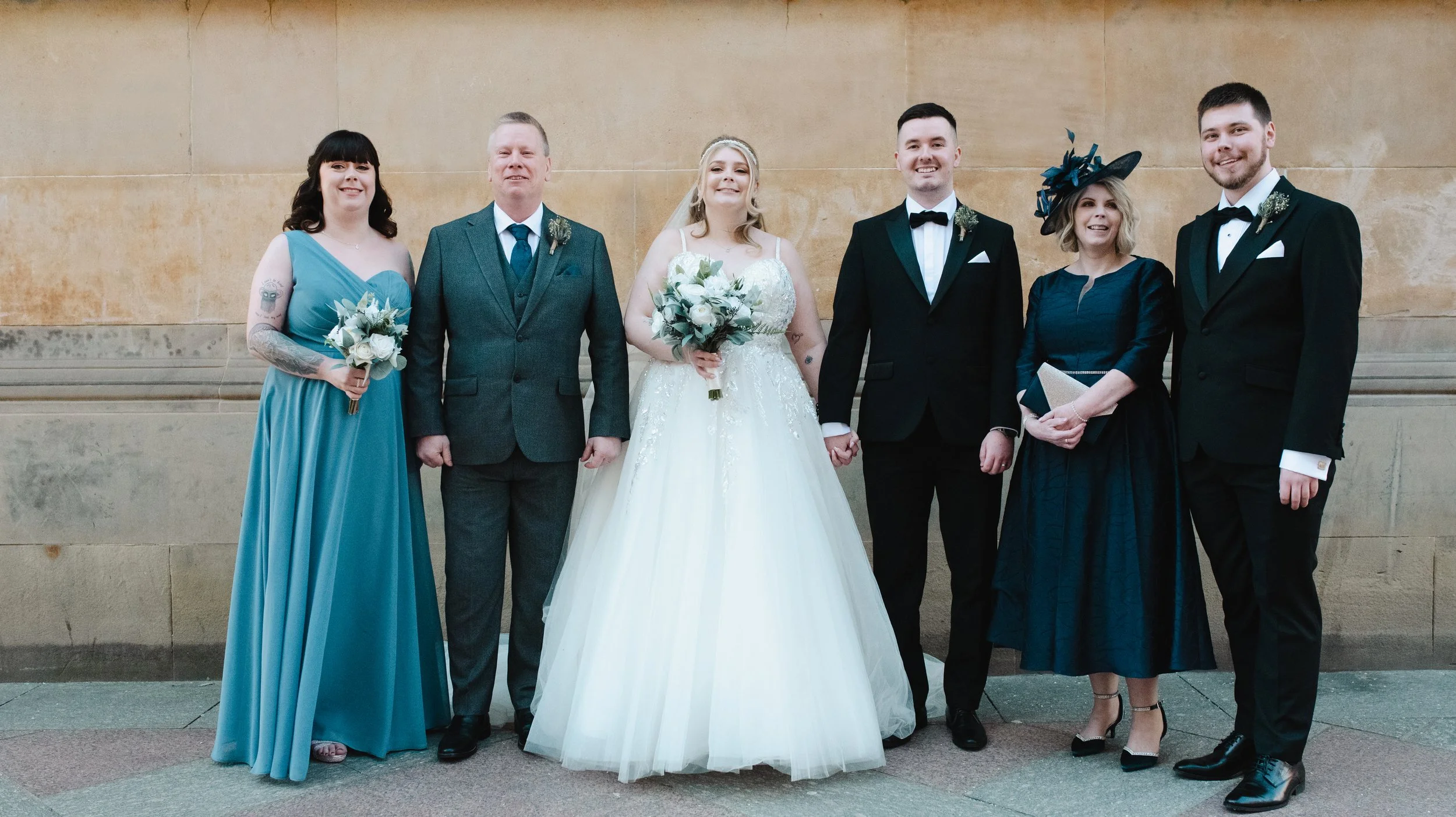 Bride and groom with their parents and wedding party in Glasgow city centre