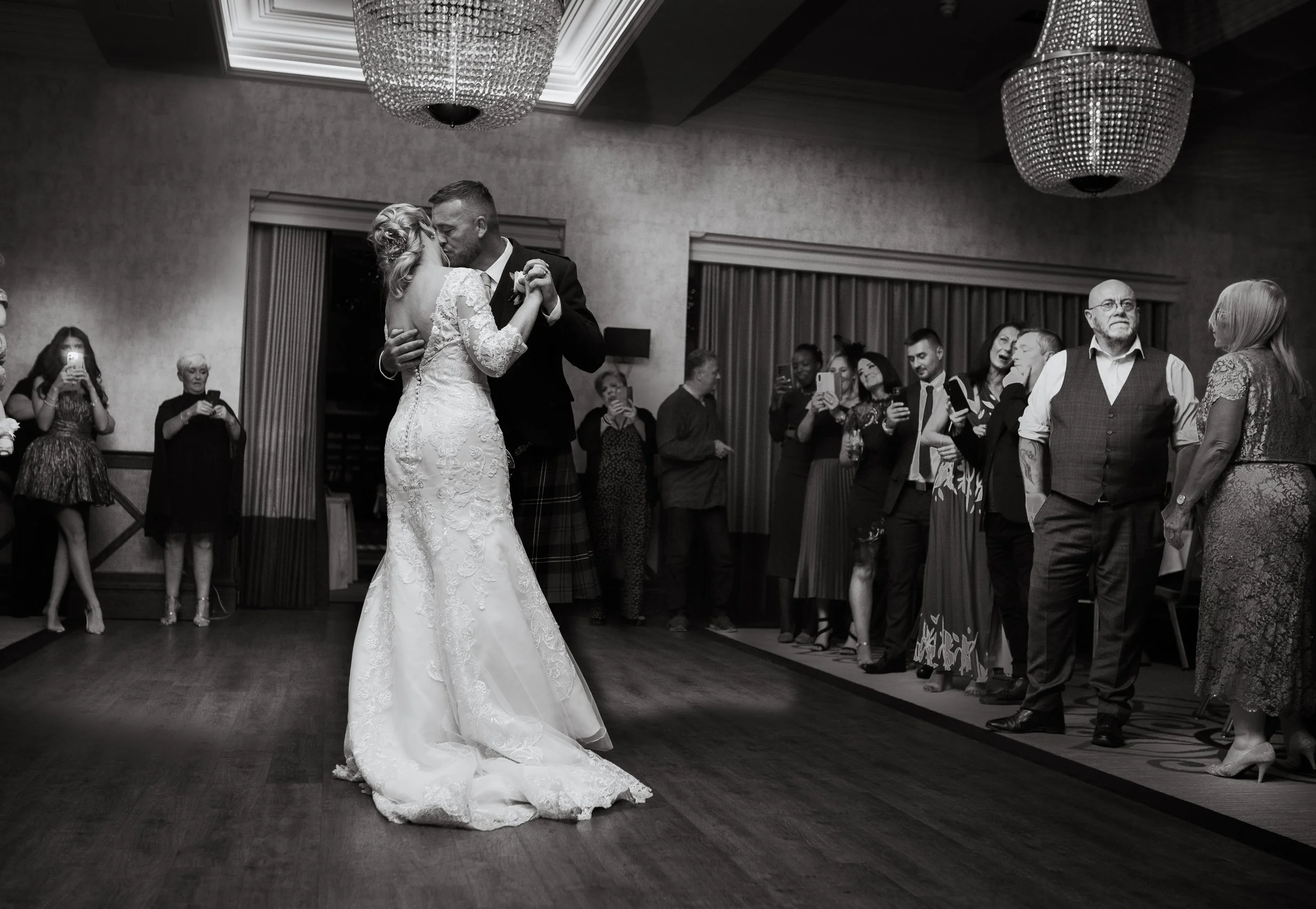 A newly wed couple sharing their first dance together
