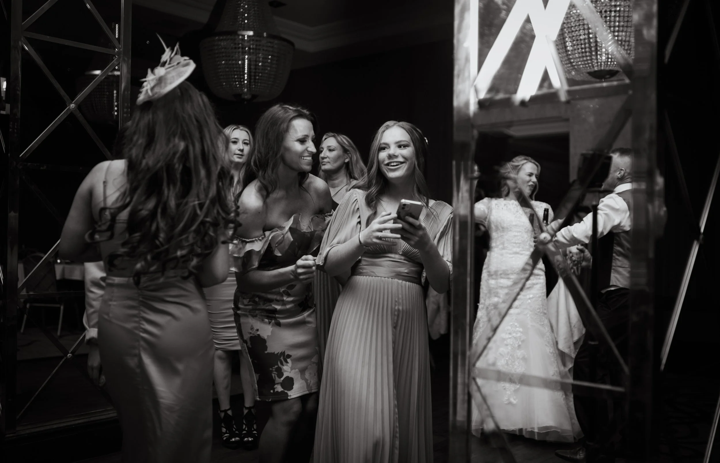 Wedding guests having a laugh together at the reception