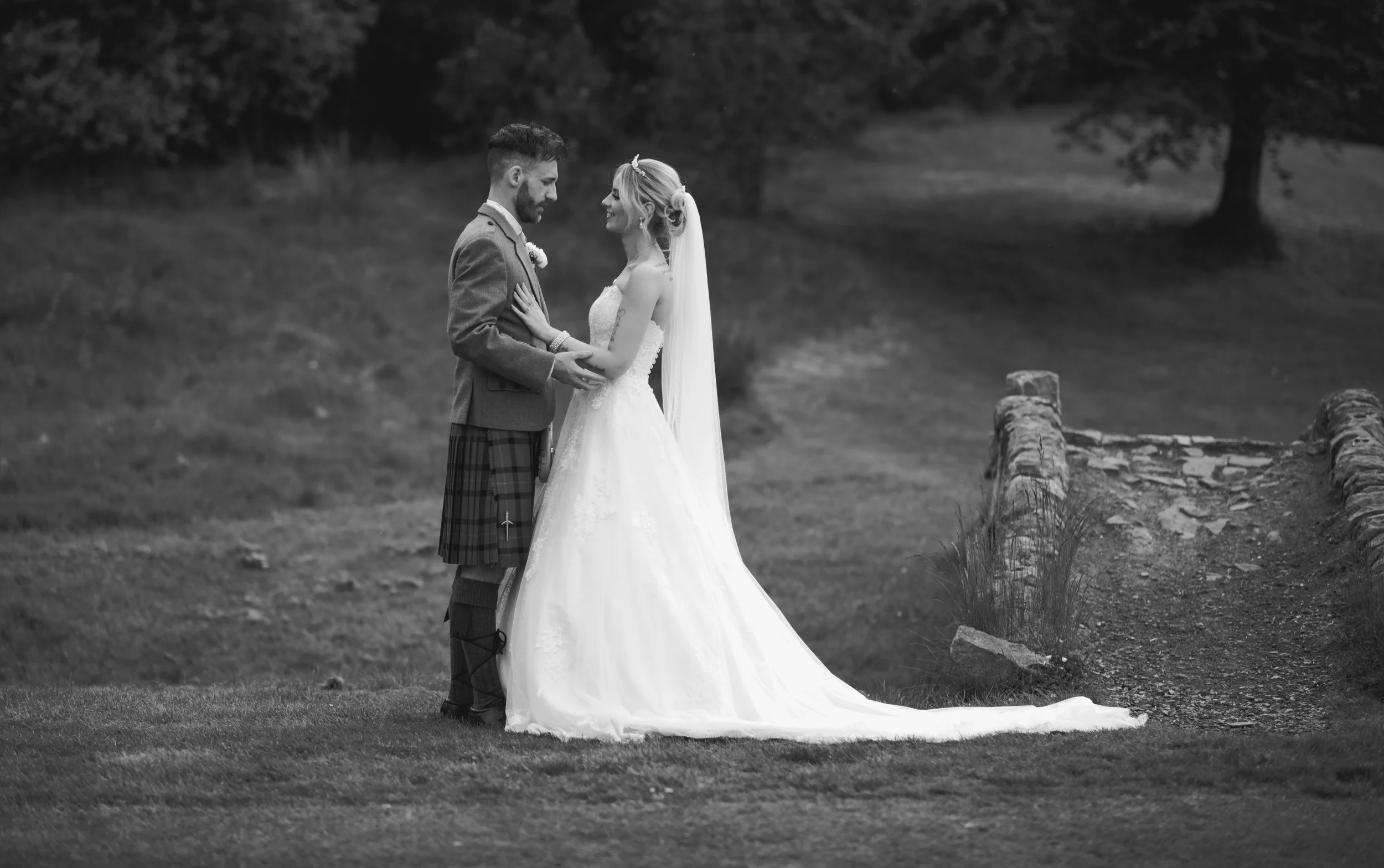 Bride and groom sharing a quiet moment outdoors on their wedding day