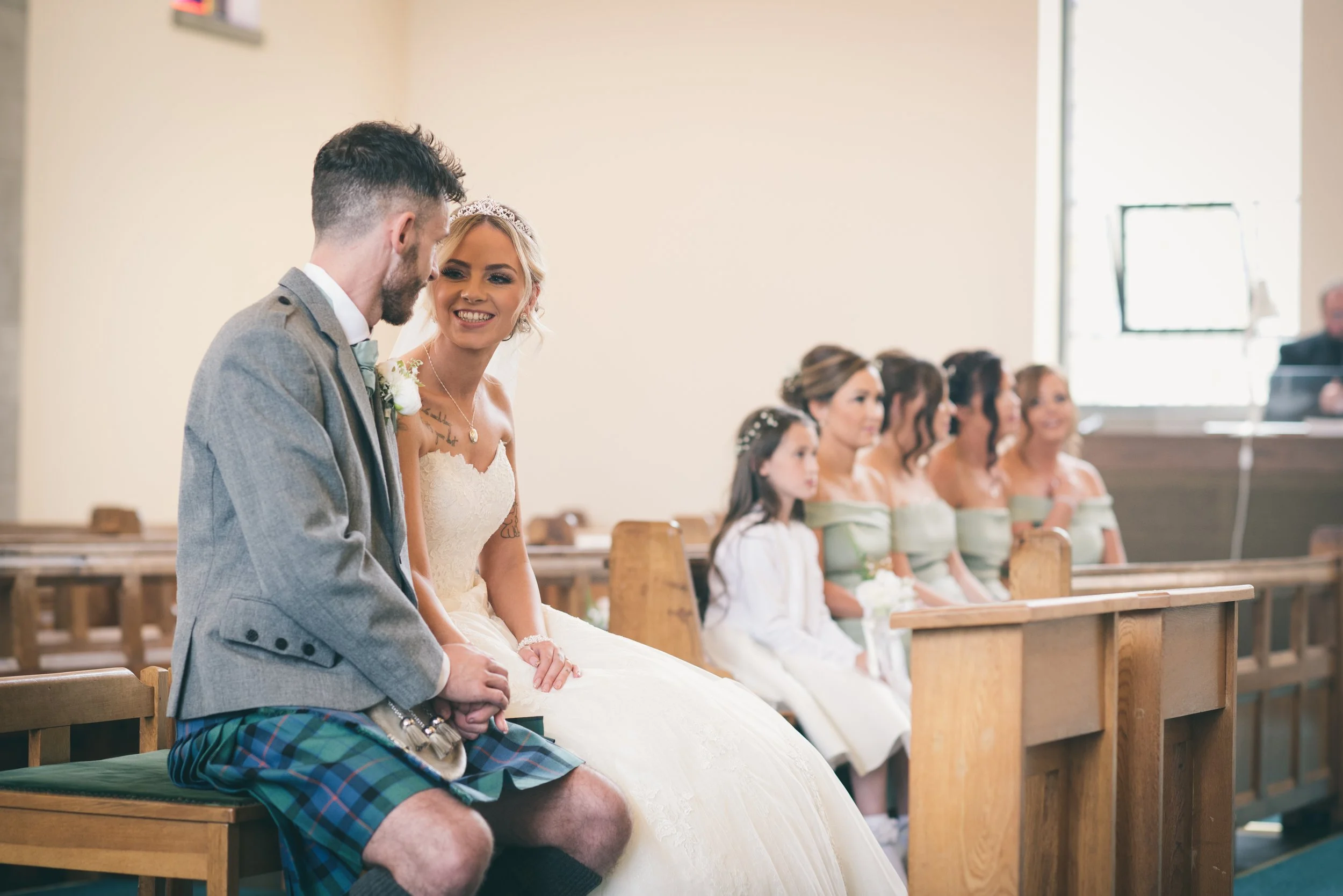 Bride and groom sitting together during their wedding ceremony