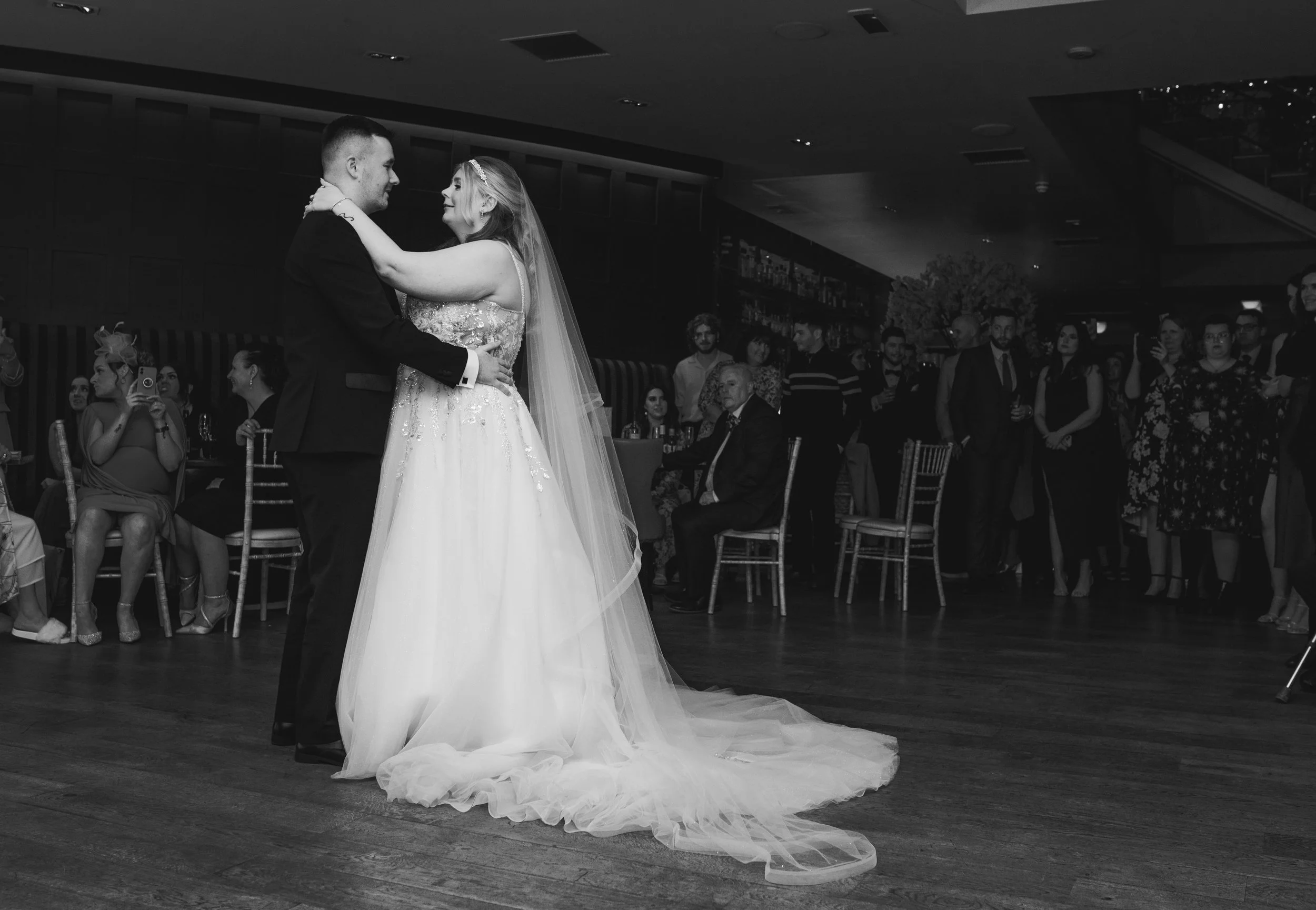 Newlyweds sharing their first dance surrounded by wedding guests at Citation Glasgow
