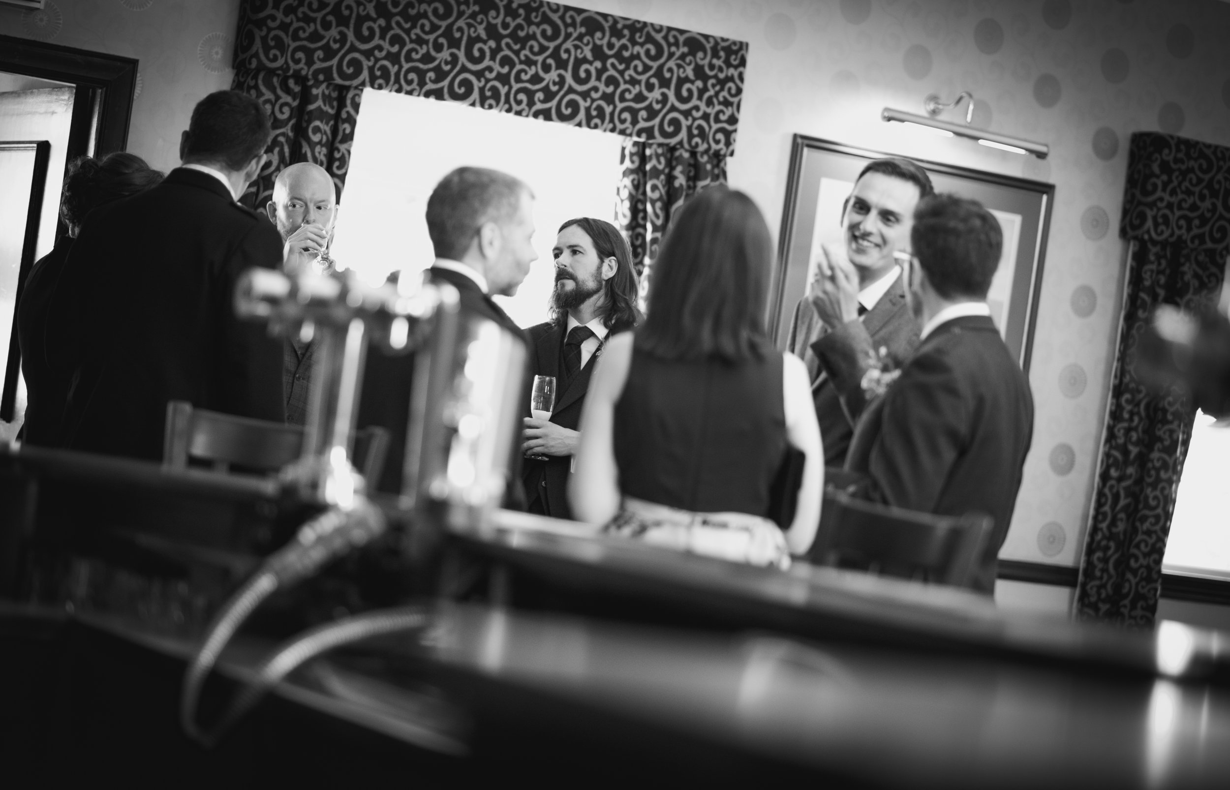 Wedding guests chatting and enjoying relaxed conversations during the reception