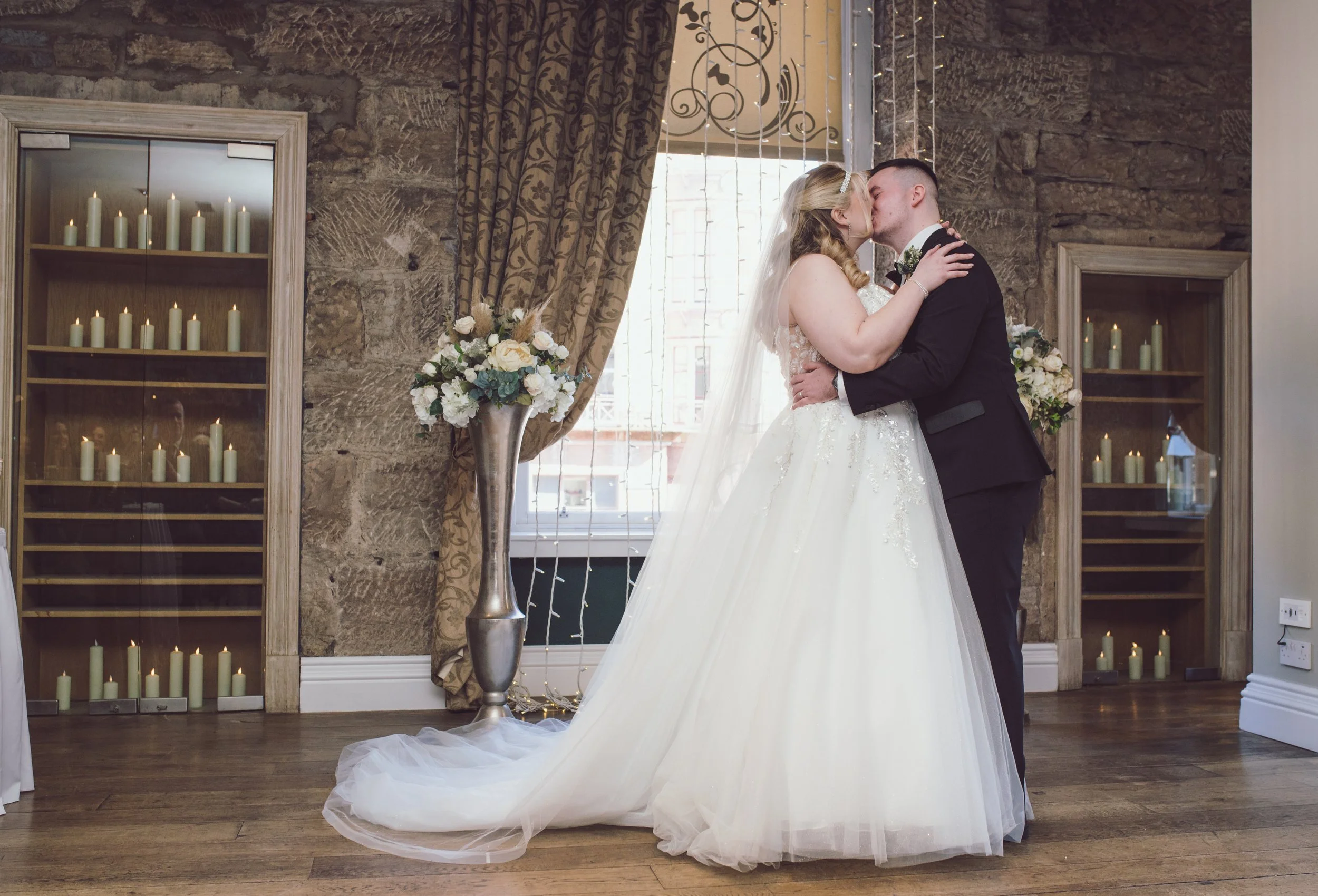 Newlywed couple sharing their first kiss at Citation wedding venue in Glasgow