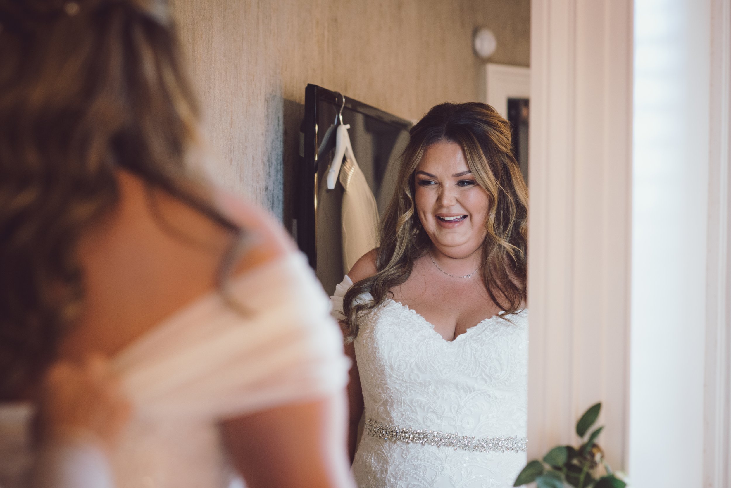 Bride smiling as she prepares for her wedding day