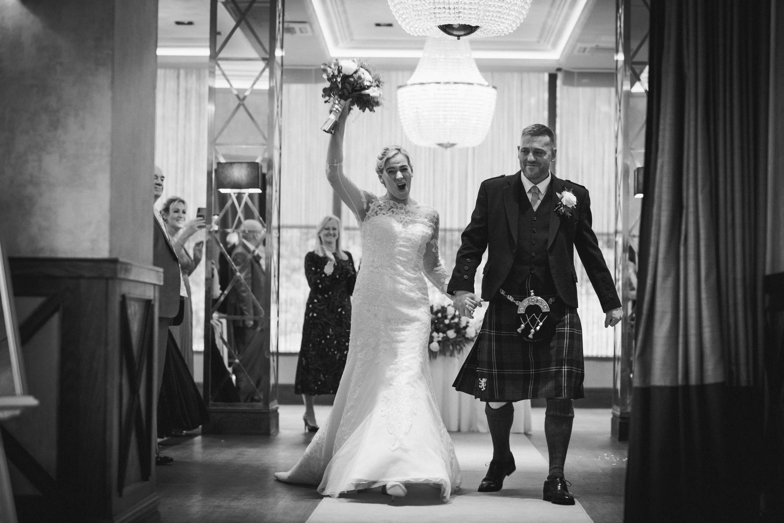 ride and groom walking together through their wedding venue