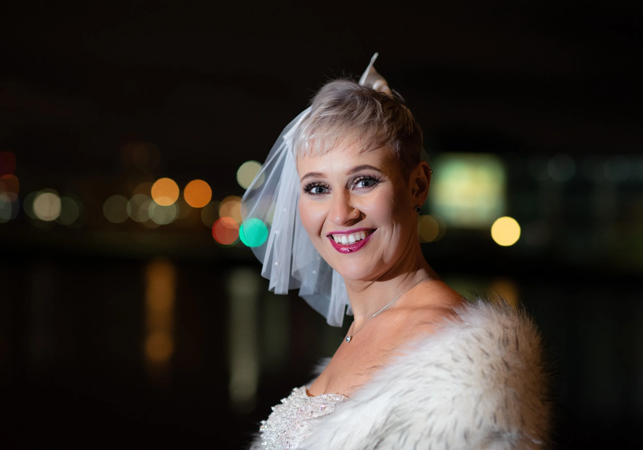 Bride smiling in a beautiful evening wedding portrait