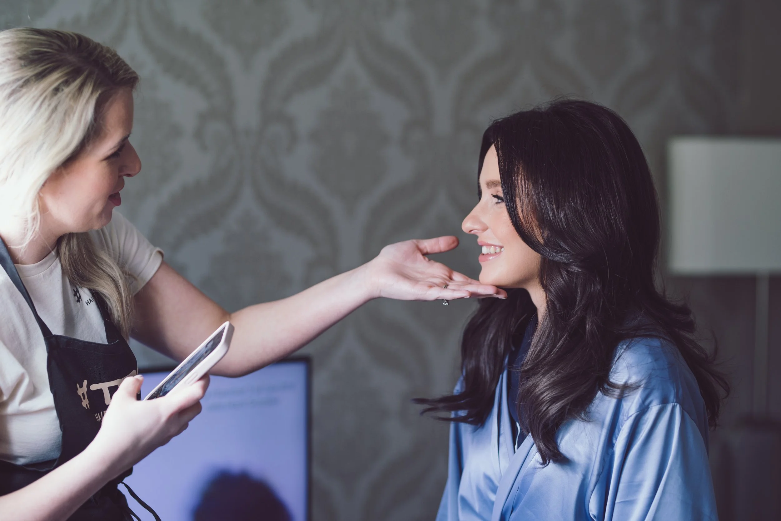Bridesmaid having her makeup finished during wedding preparations at Citation Glasgow
