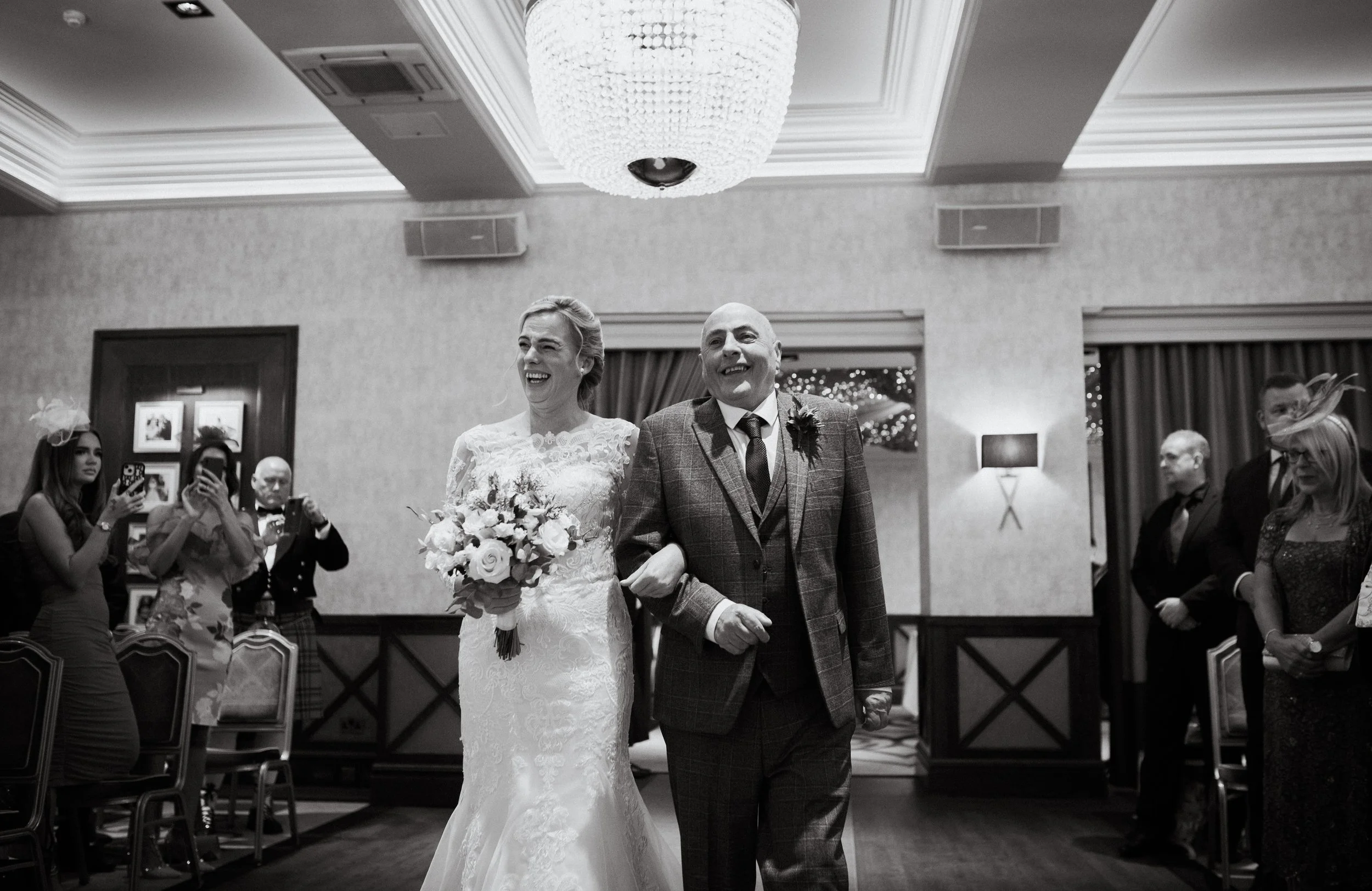Bride and father walking down the aisle