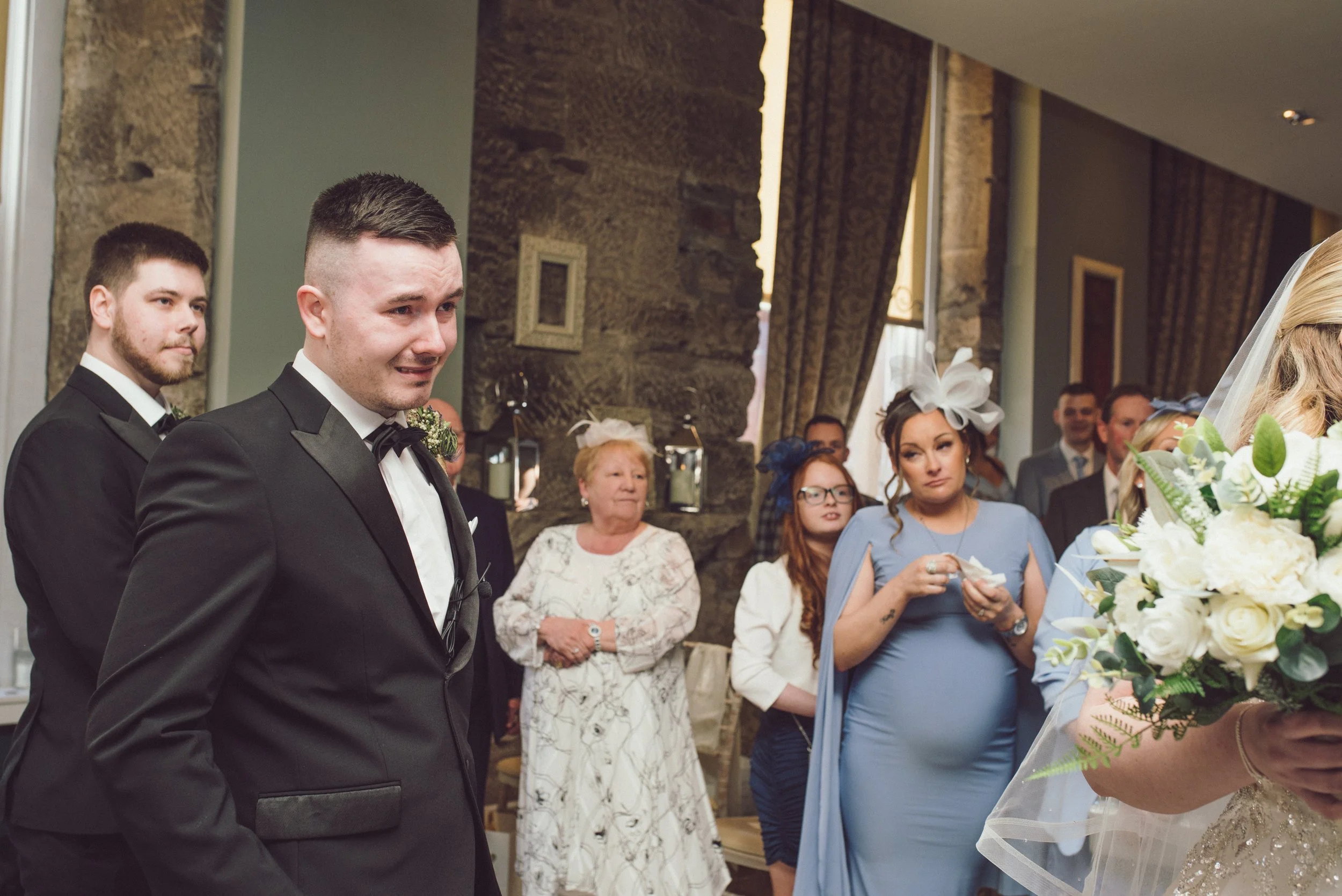 Groom seeing his bride arrive at their wedding ceremony at Citation Glasgow