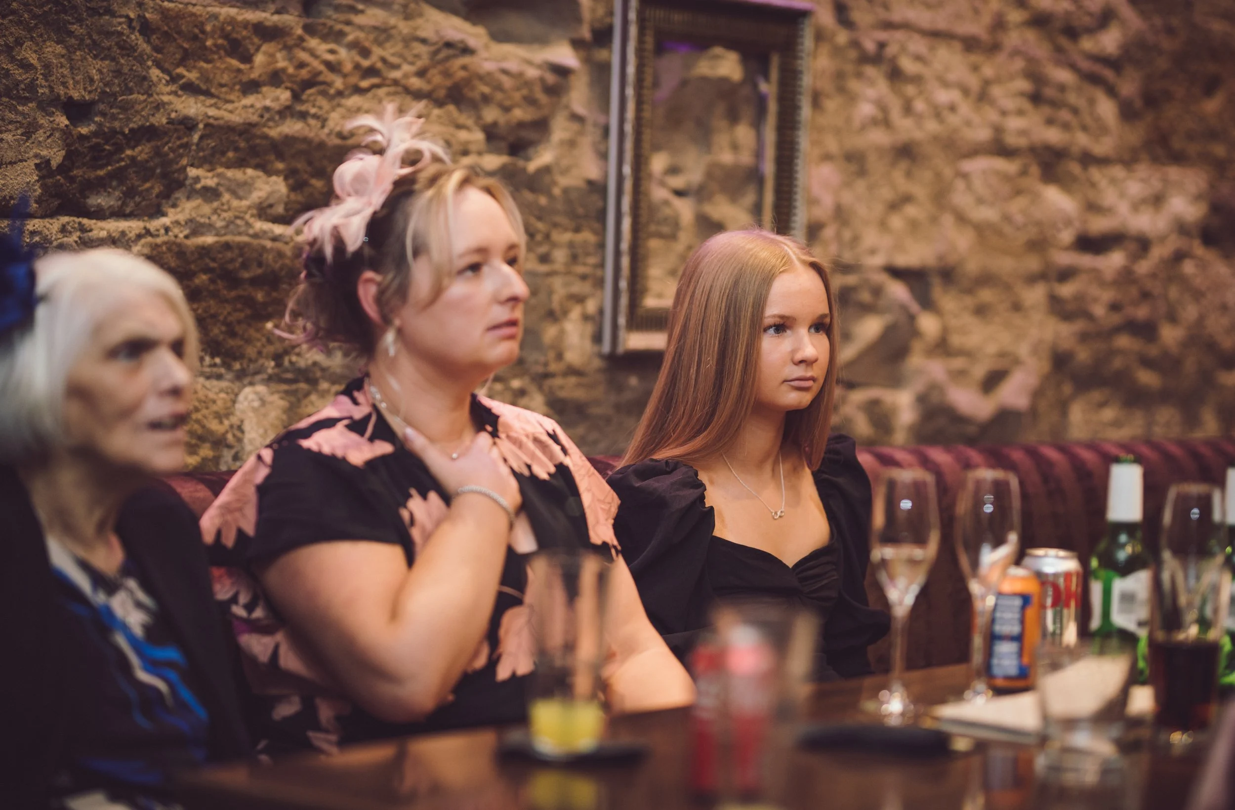 Wedding guests listening during speeches at a relaxed Glasgow wedding reception