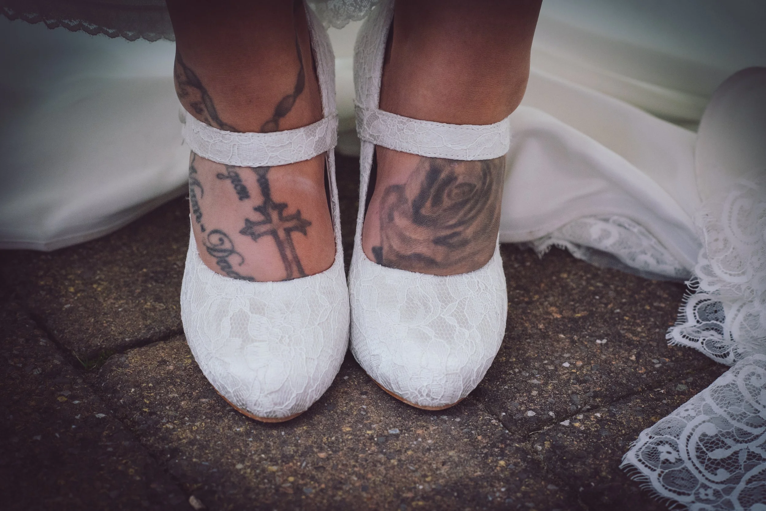 Close-up of the bride's lace wedding shoes during the wedding celebrations