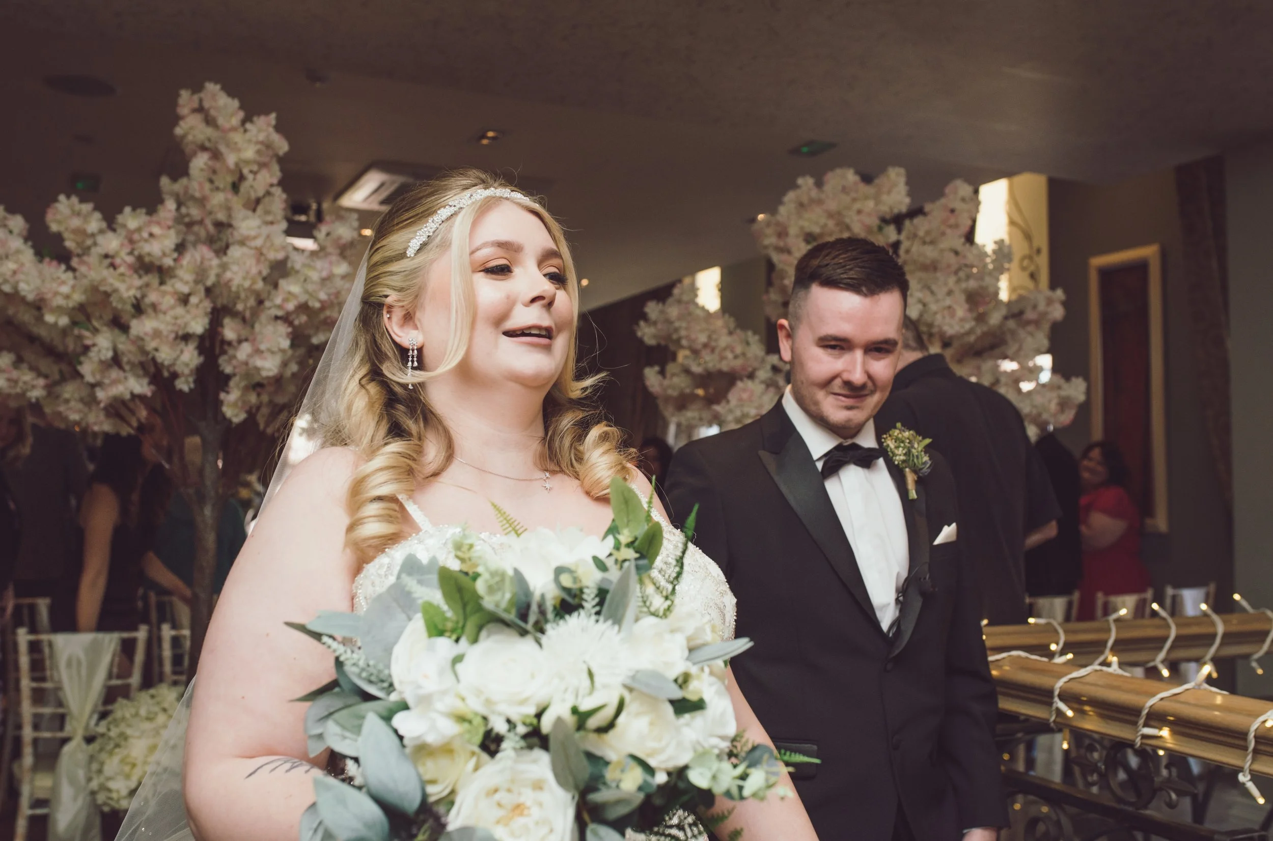 Newlywed couple walking together through their wedding reception at Citation Glasgow