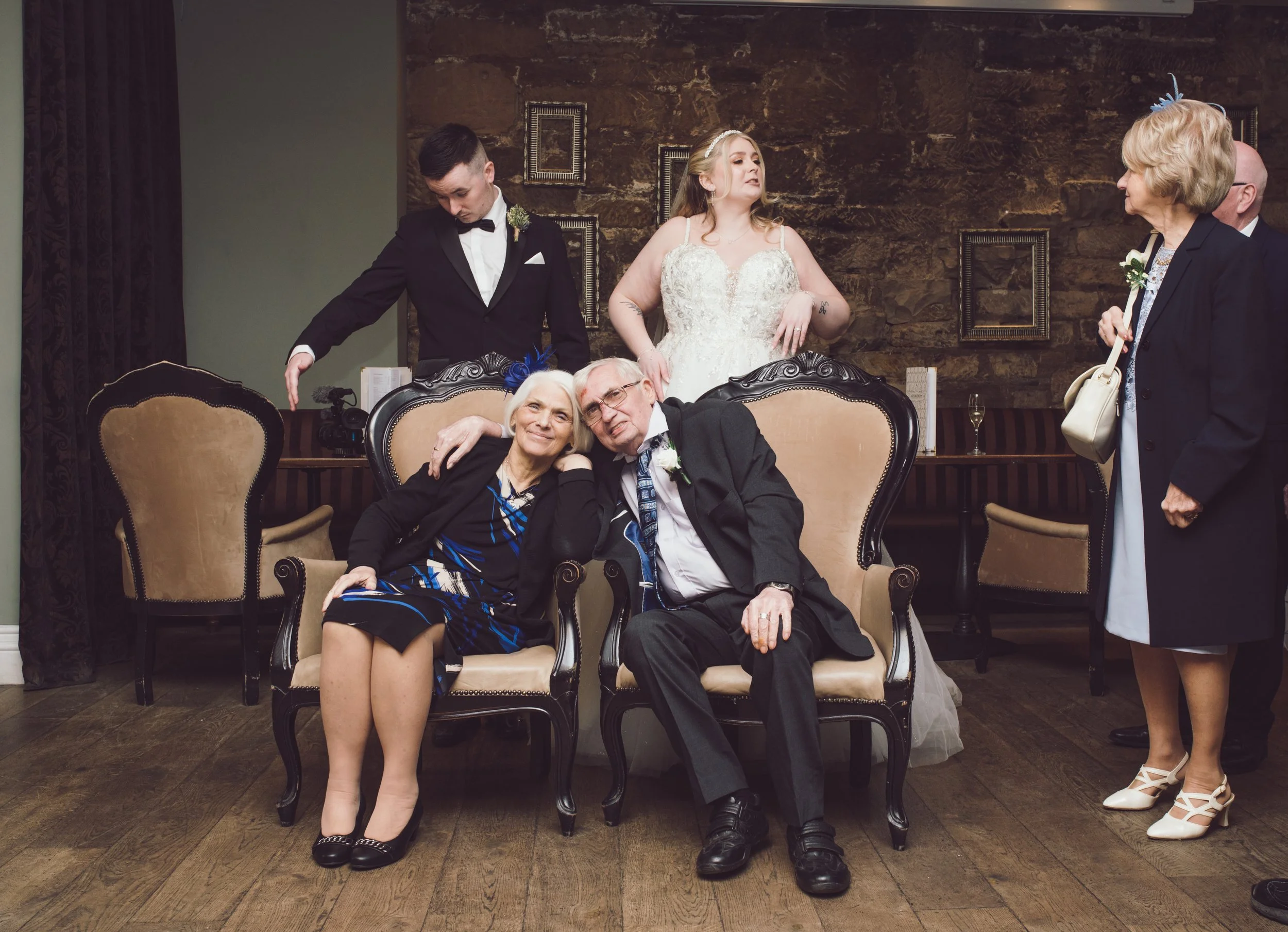 Bride and groom with family members during a relaxed wedding reception at Citation