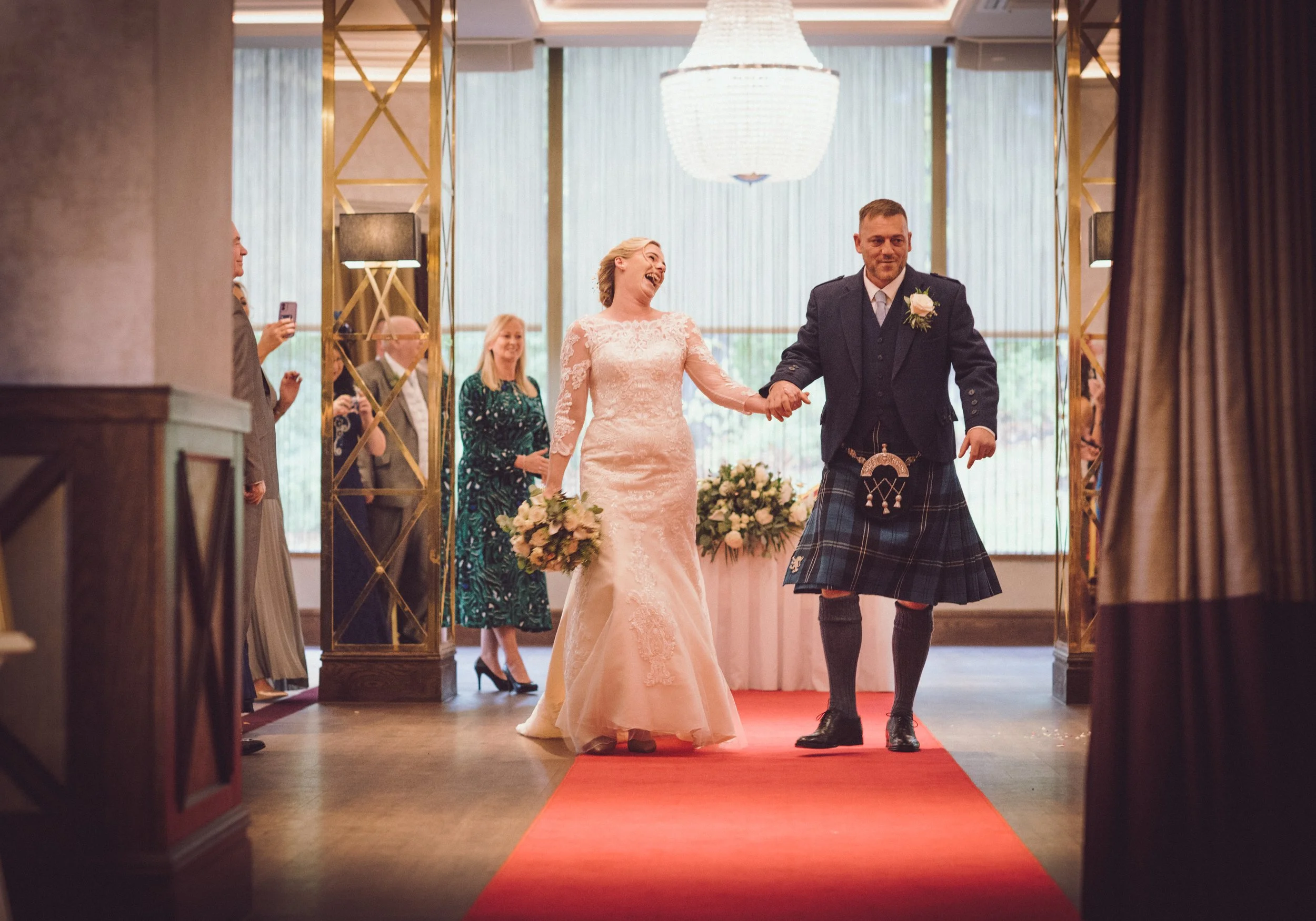 Bride and grom walking together after the ceremony