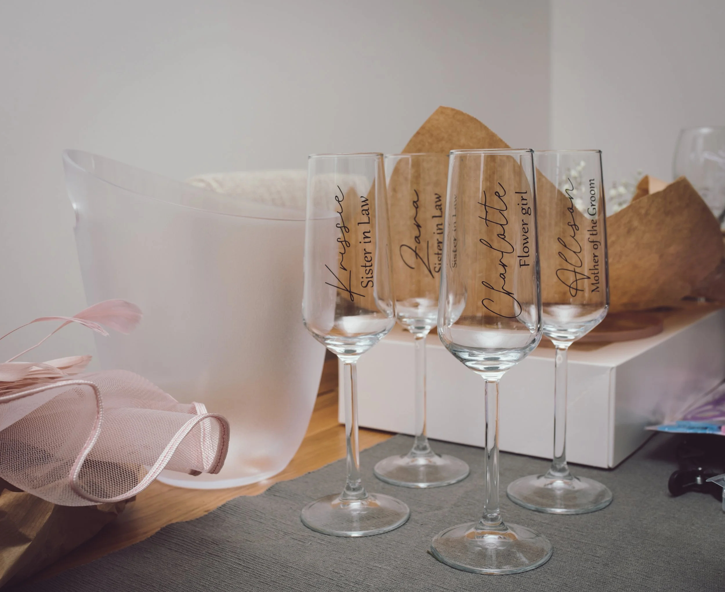 Personalised wedding glasses prepared for the bride, groom and wedding party