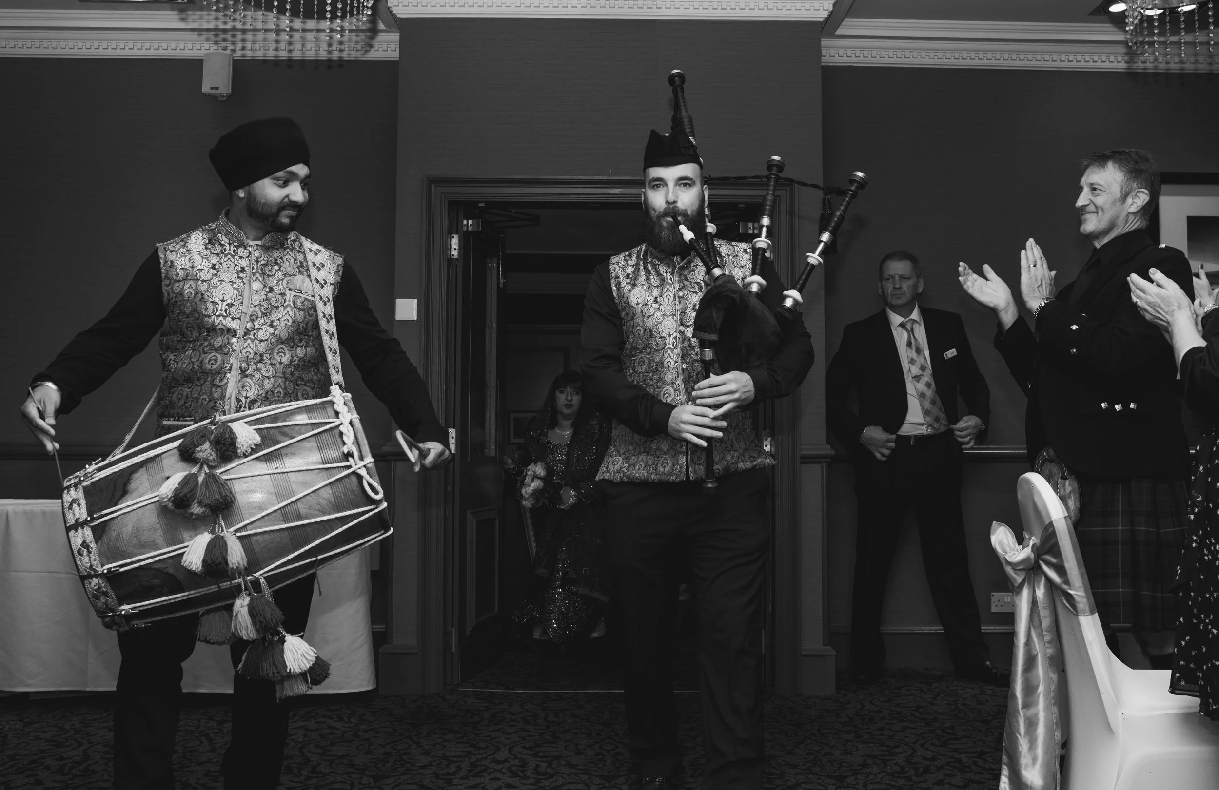 Traditional Indian wedding musicians performing with drums and bagpipes