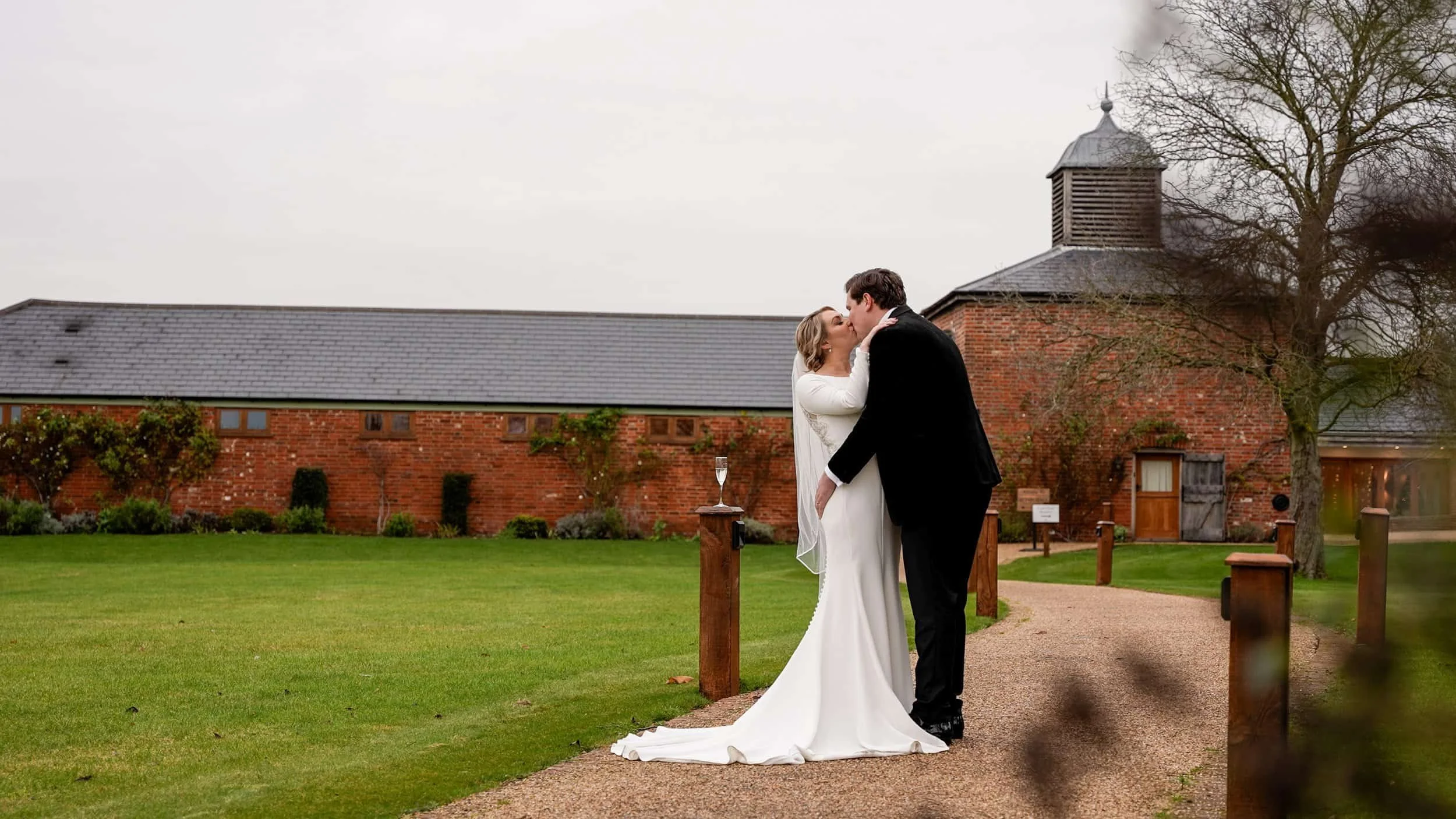 Cinematic videography of couple kissing outside Apton Hall romantic couple on wedding day