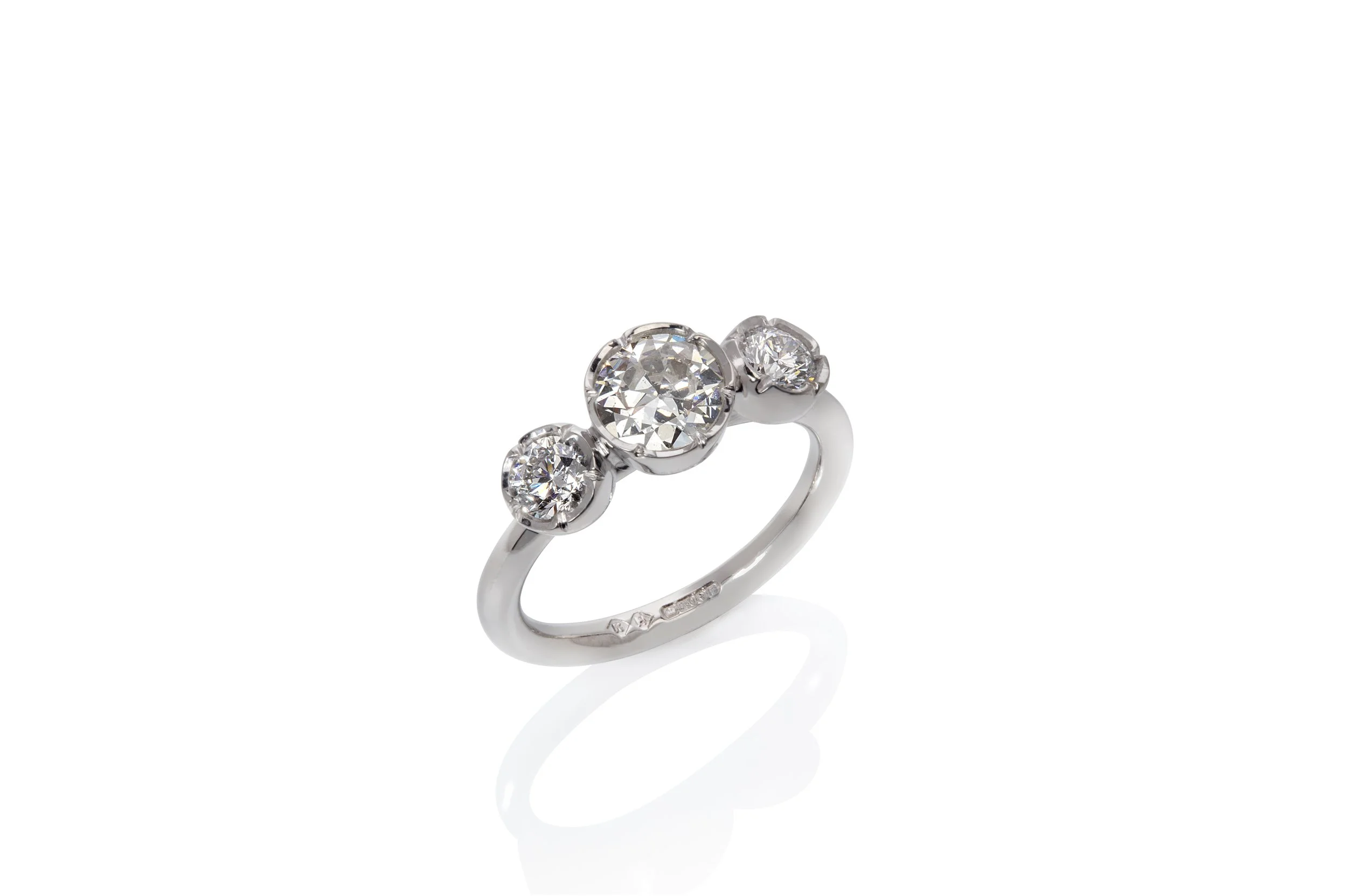 Three Stones, One Family: A Bespoke Flower-Set Ring in White Gold