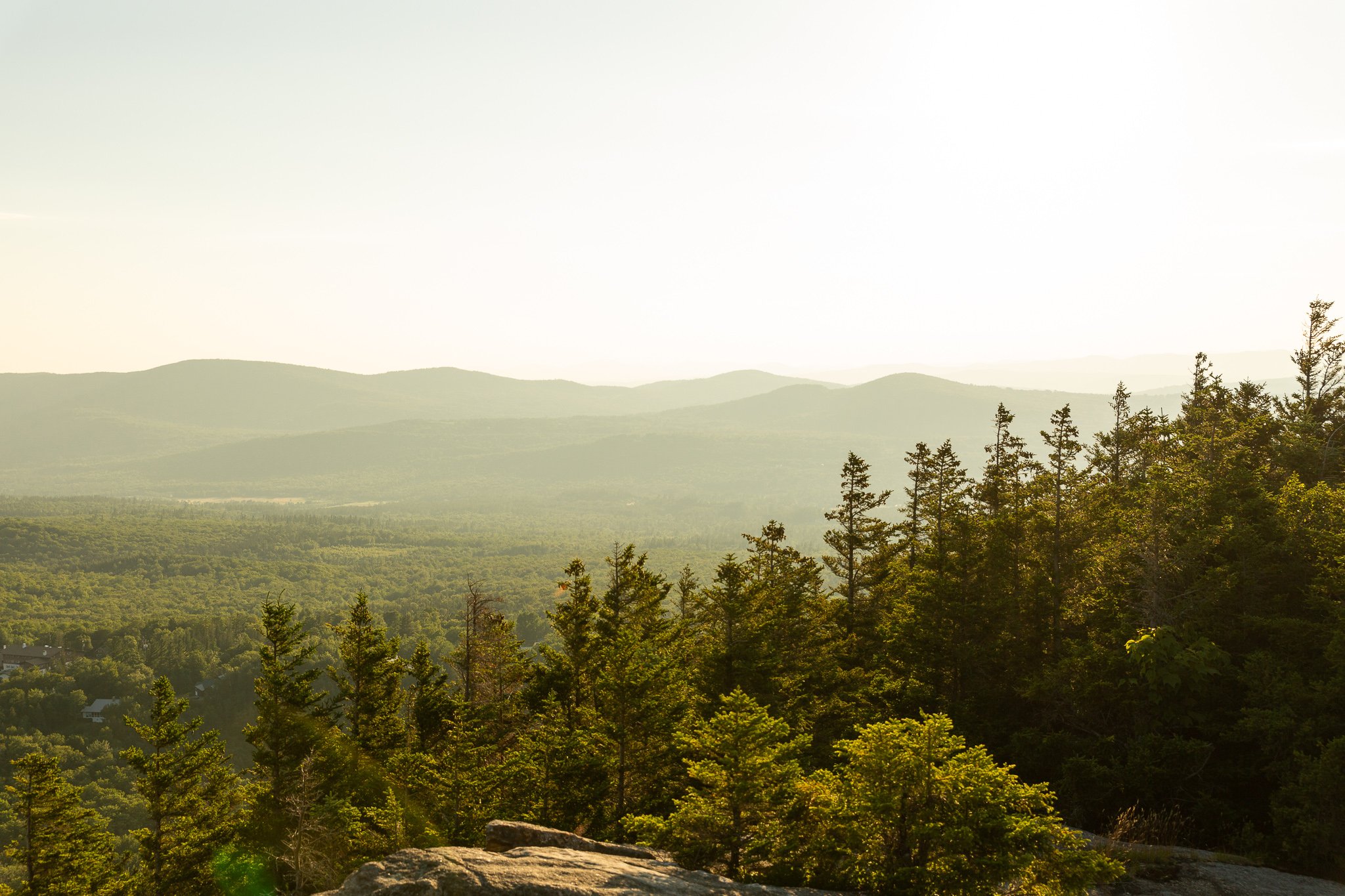 picture of Franconia Notch White Mountains from a peak at sunset in summer
