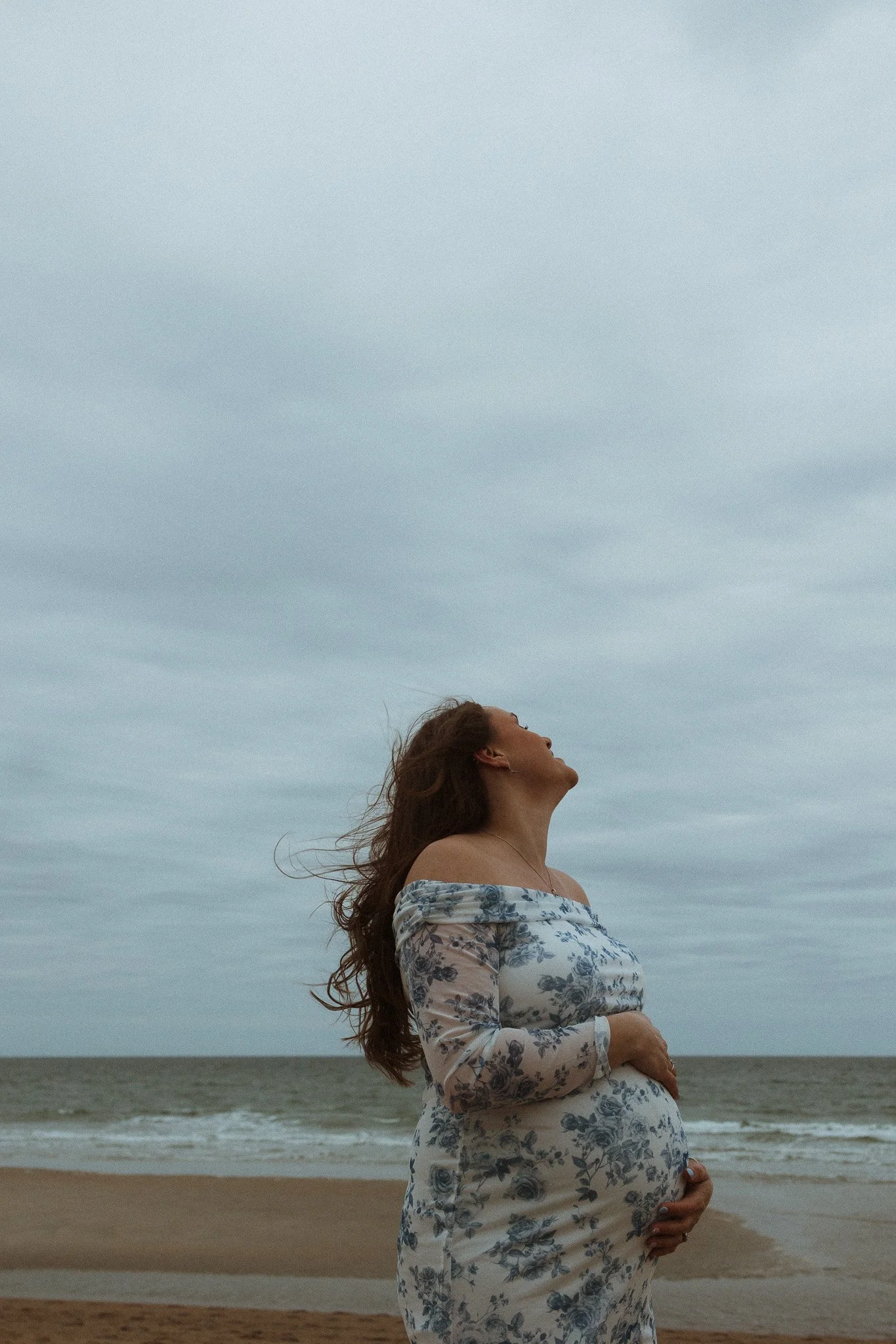 maternity session at Seabrooke beach New Hampshire in early March