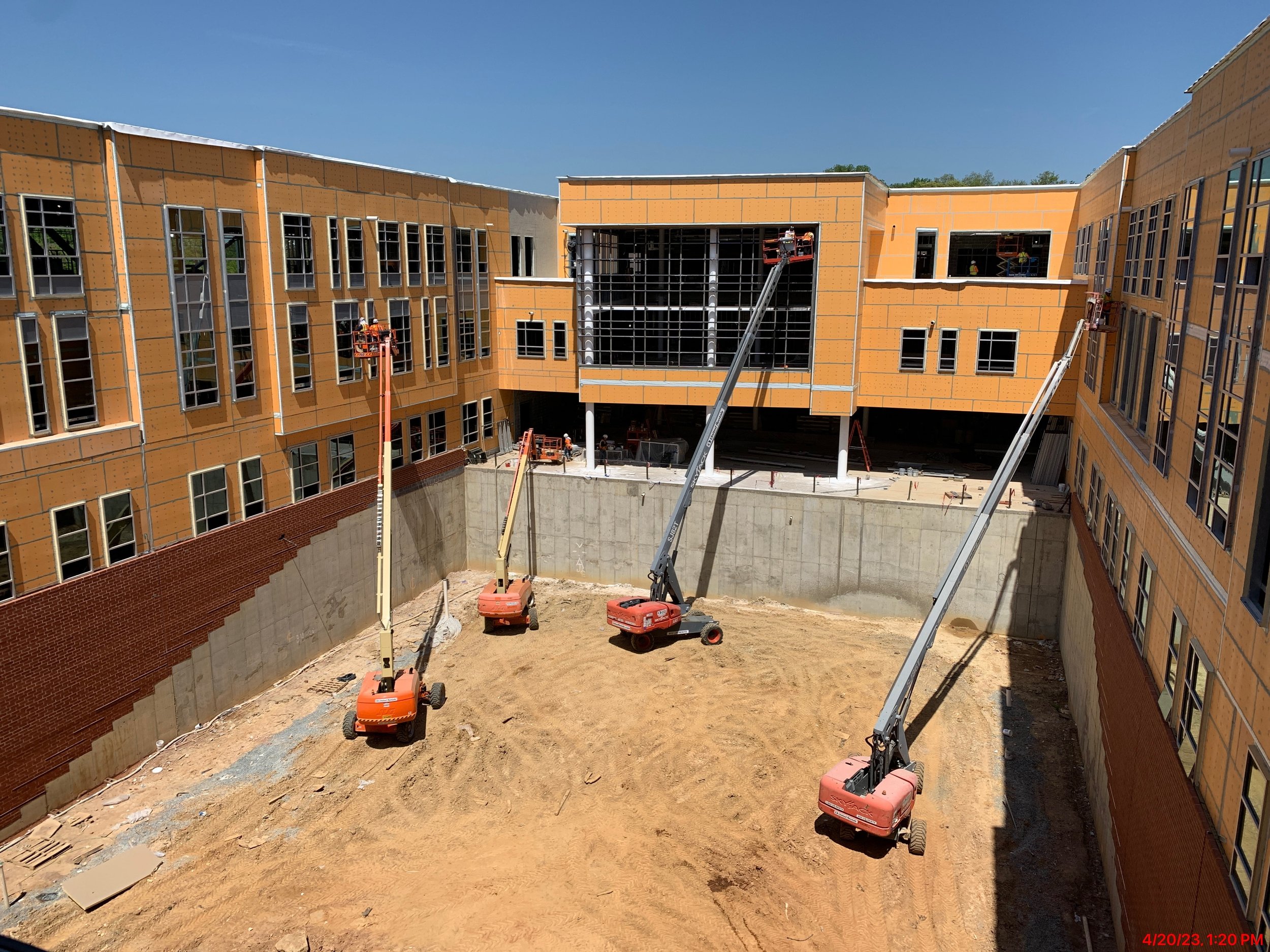 The roofing is complete with the building interior protected from above.