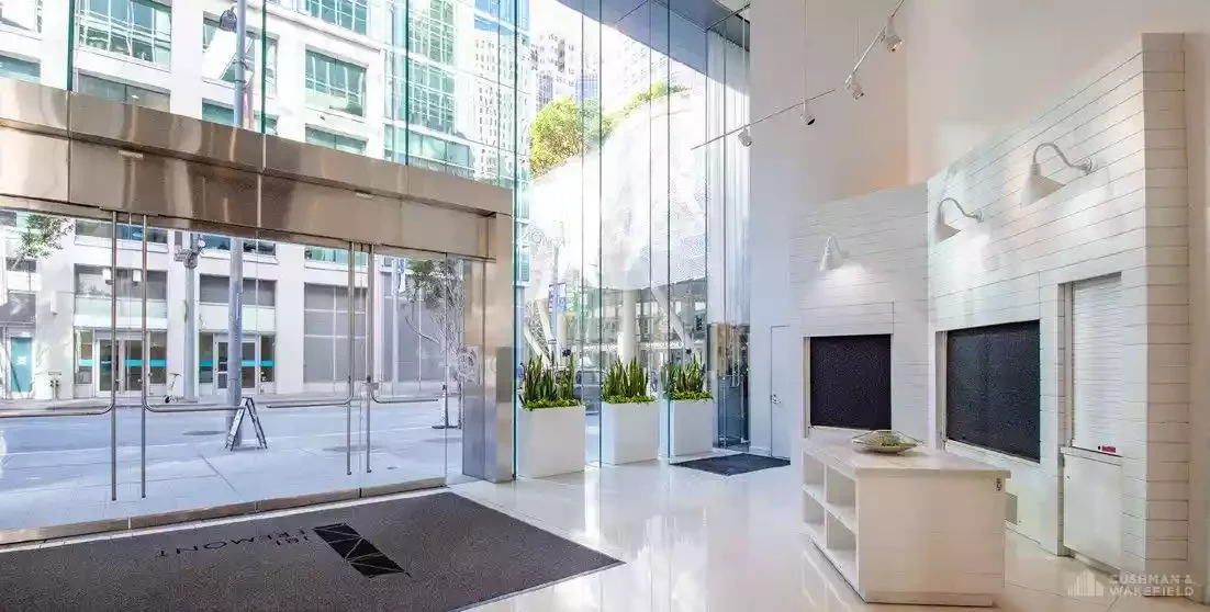 Photograph of street level commercial entrance. Courtesy of Heller Manus Architects