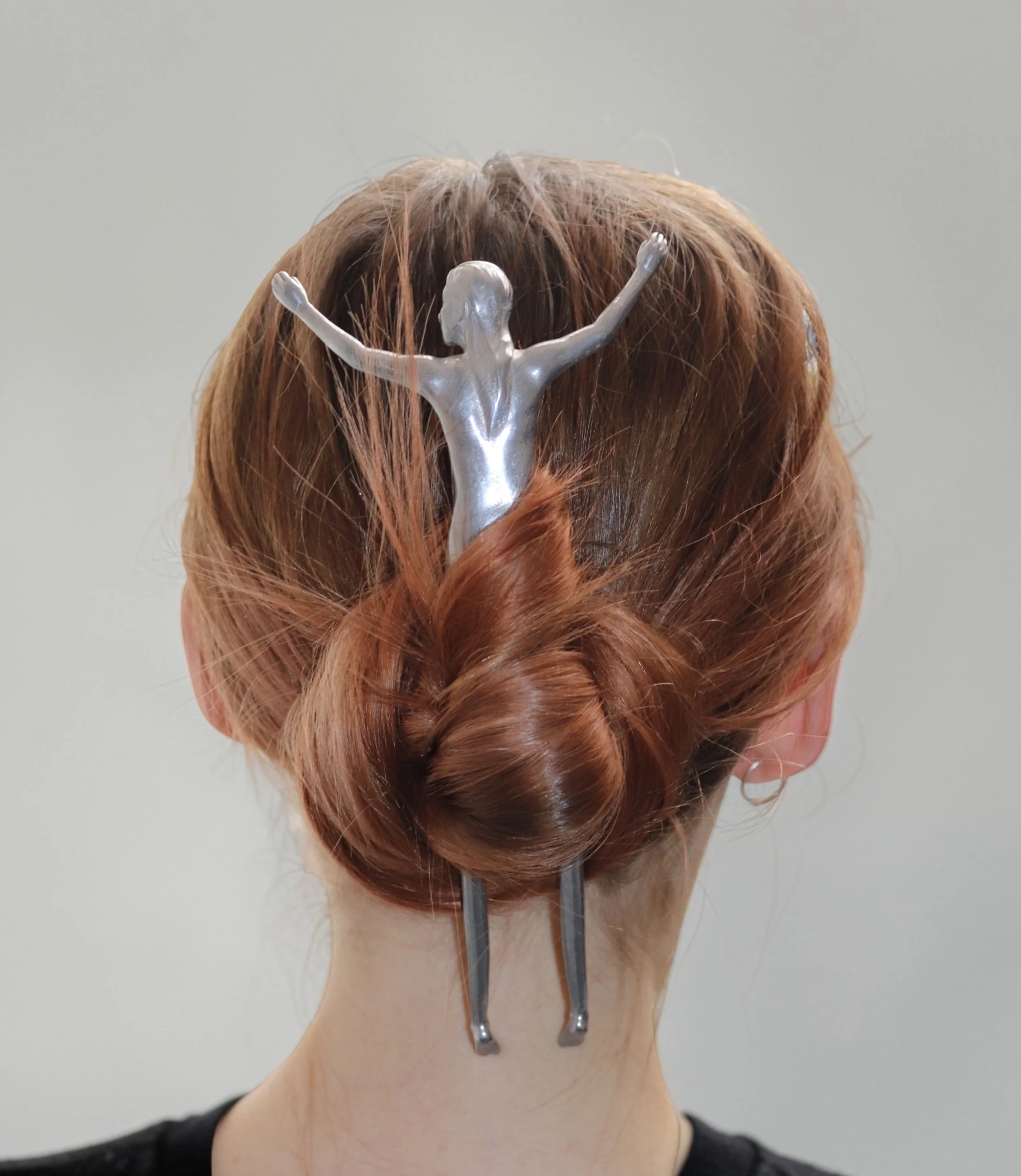 self portrait as hair stick 
2026
aluminum
8.7 x 3.2 x 2.9"
