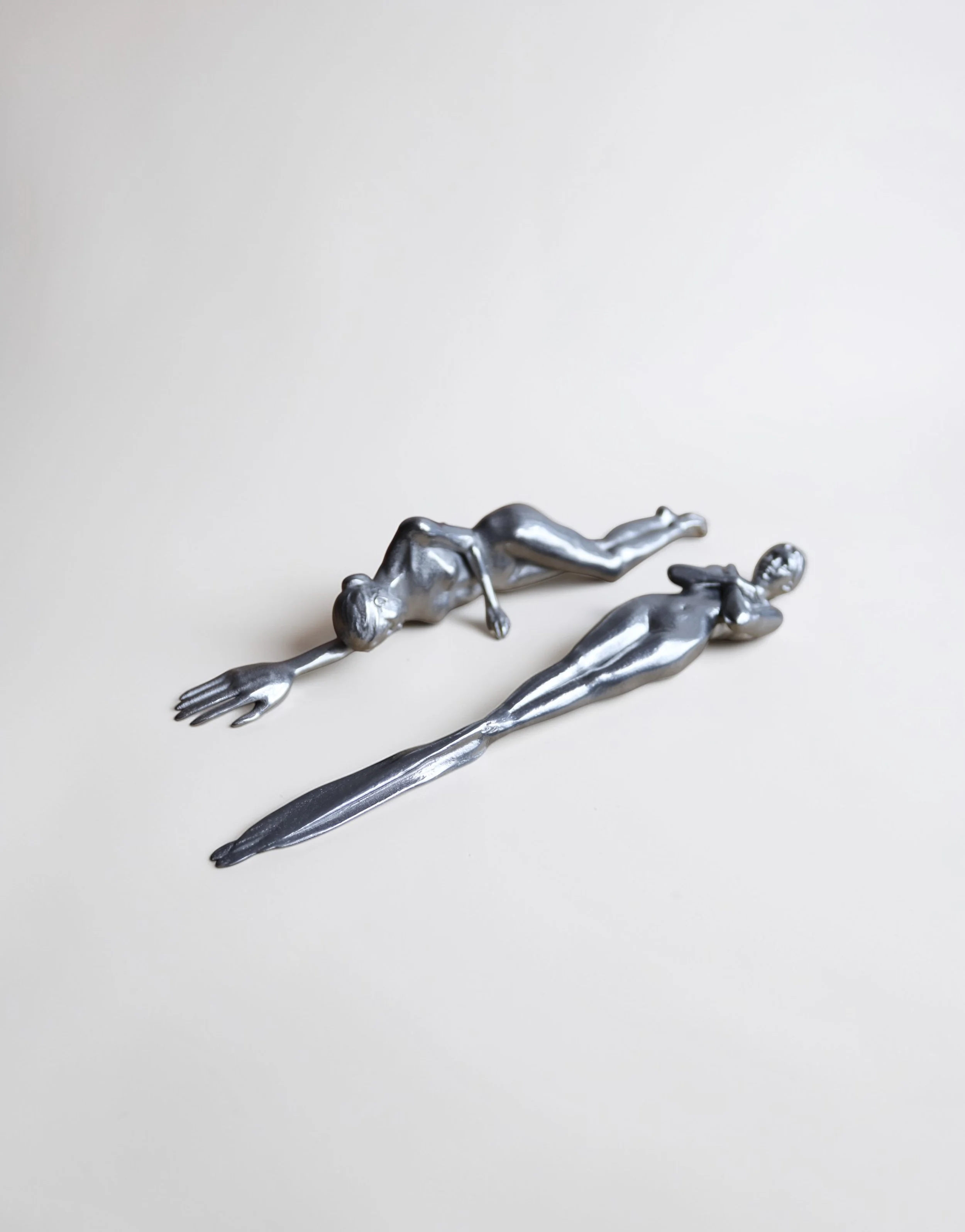 fork and knife
2026
silver alloy 
(roughly 7 x 2 x 2" ea.)