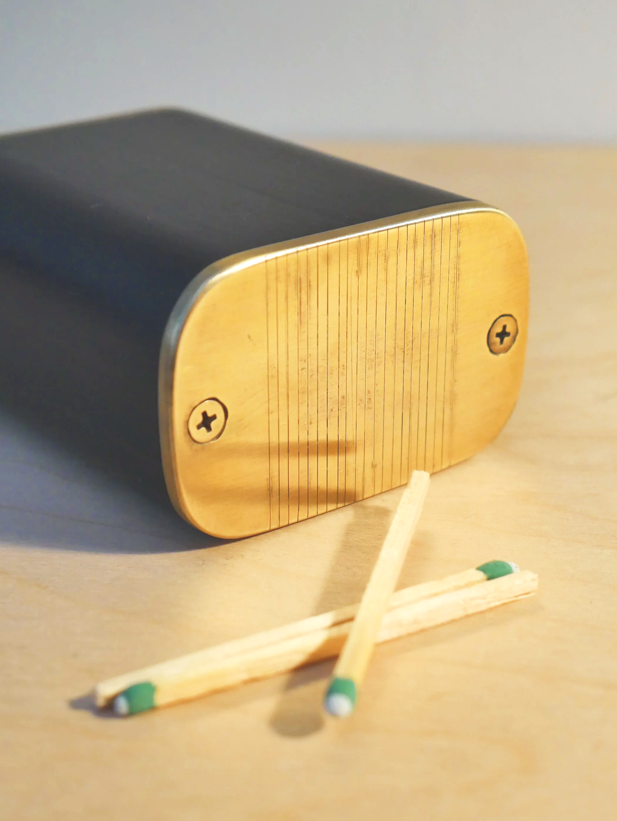 ebony match caddy: ebony with brass detail, 2.375L x 1.5W x 3H, $110
