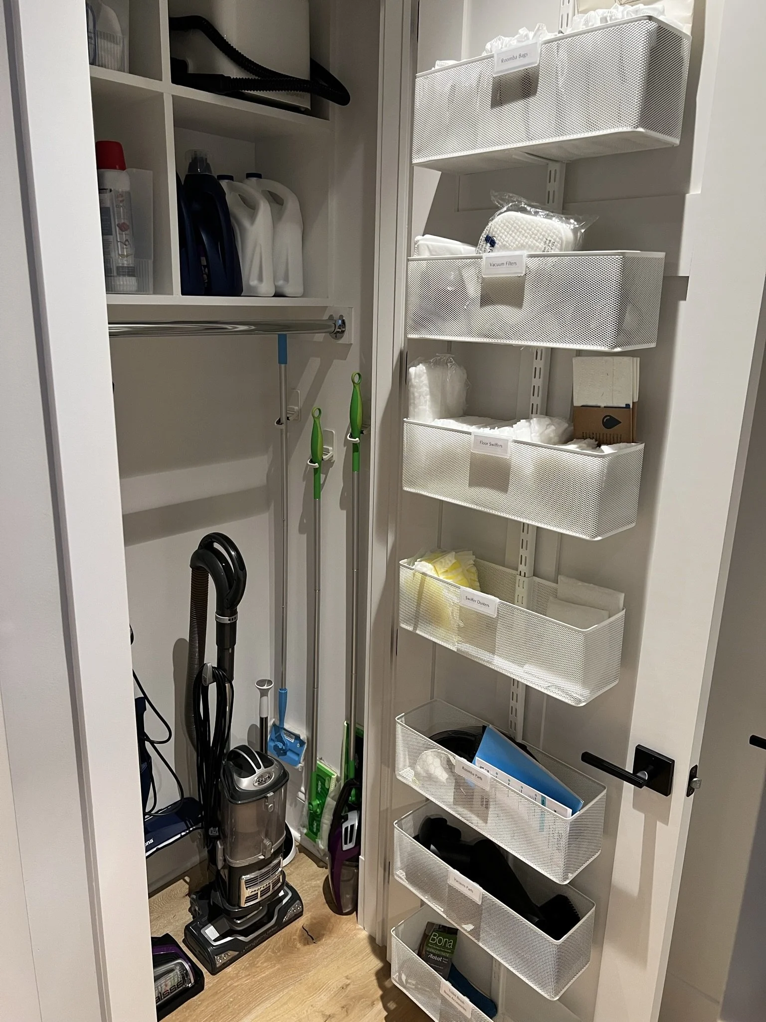 cleaning closet with an over the door elfa system