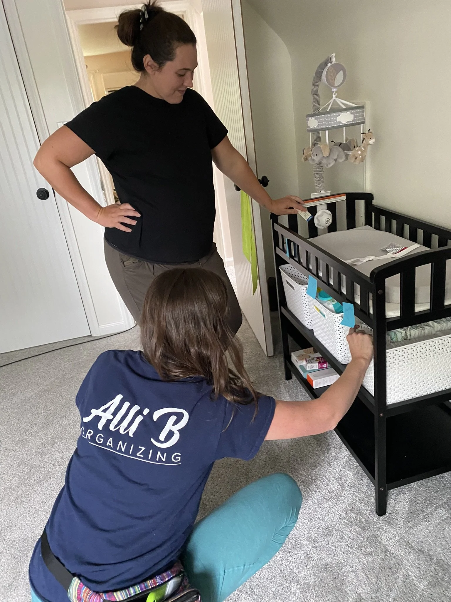 Professional Organizer Alli showing a new mom her systems during a nesting party