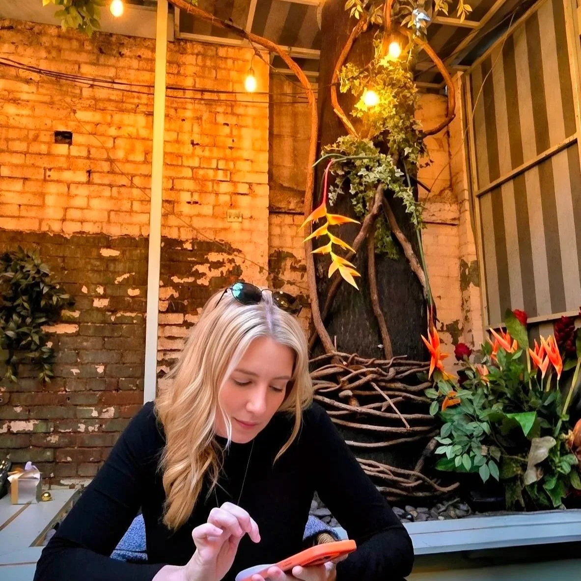 kimberly in new york looking at her phone