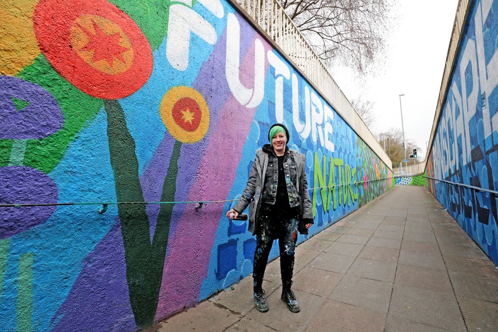 street artist sprite with Mural in coldean