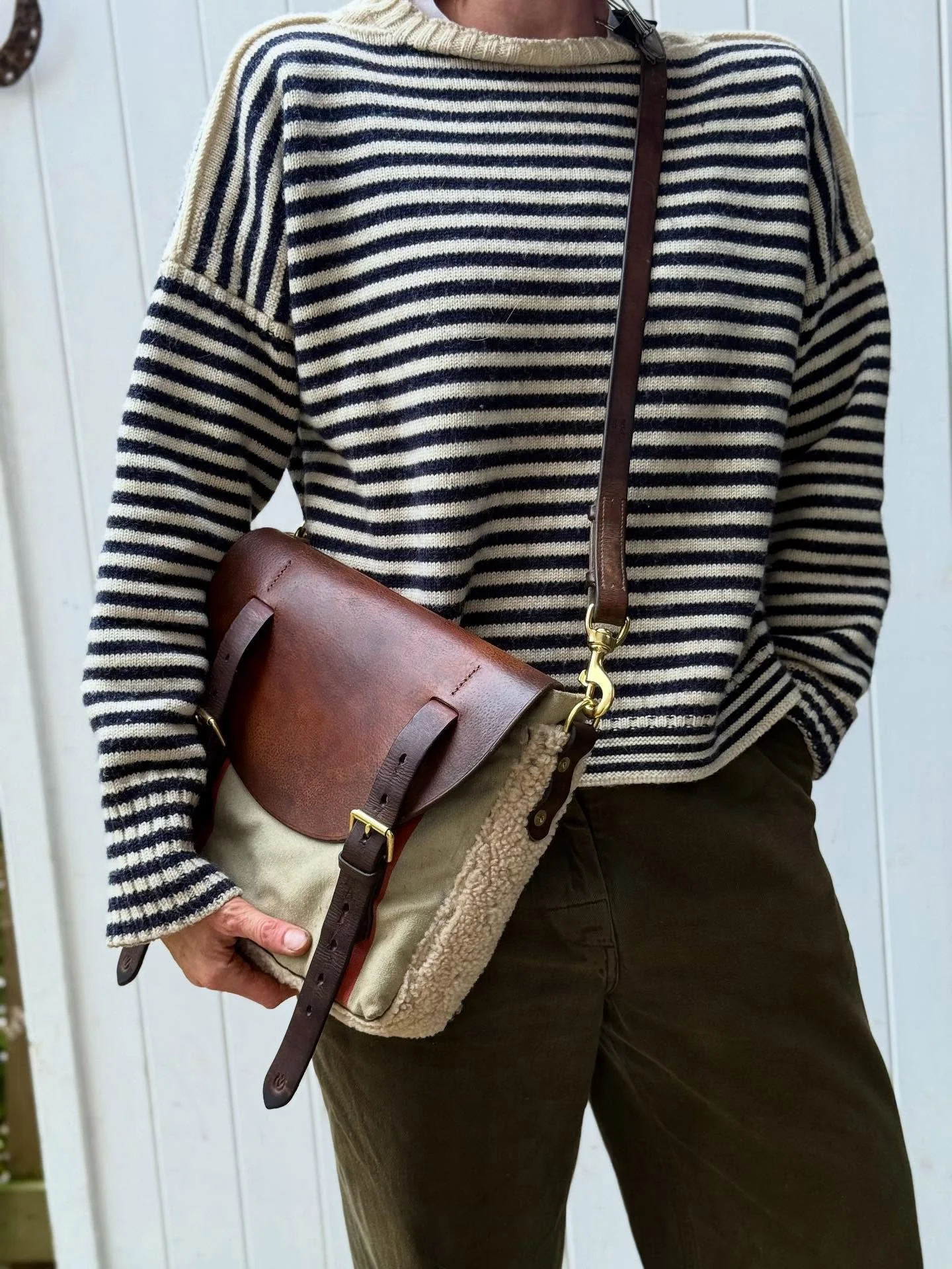 In love with this!

A rare vintage Japanese canvas mail bag, reworked into a messenger style - the perfect size, trimmed with vintage shearling - those perfectly faded red stripes - all of the above paired with such a stunning piece of beautifully ag