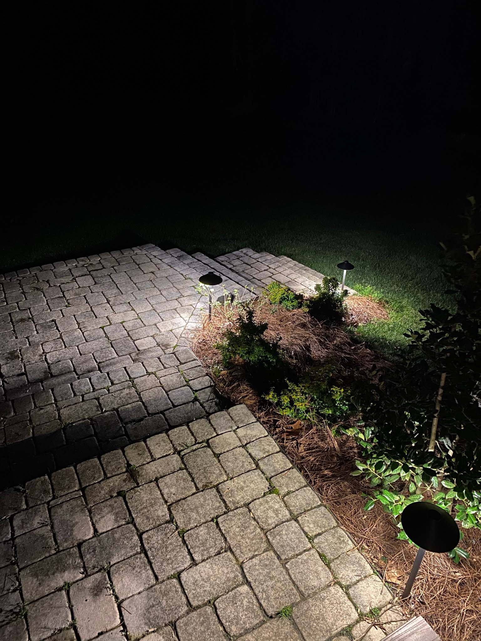  Paver stairs illuminated with traditional path lights.  