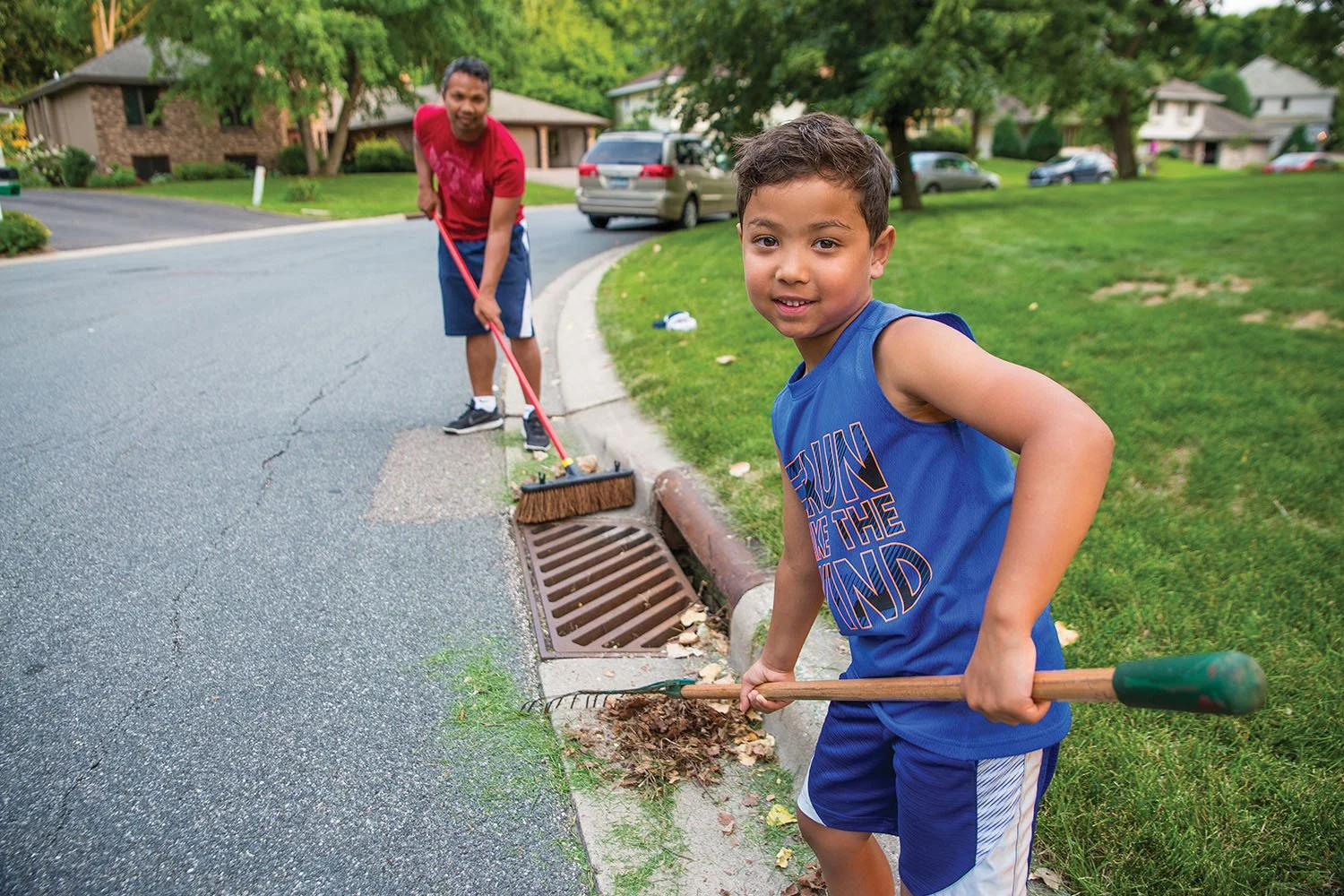 resident-storm-drain-clean-up-father-son.jpg