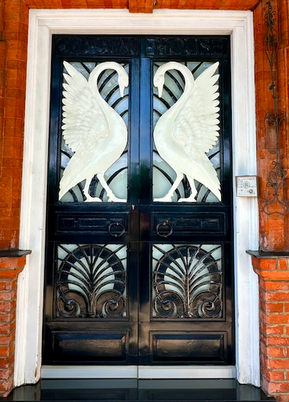 Image of a Door With Art Deco Swans in a European City