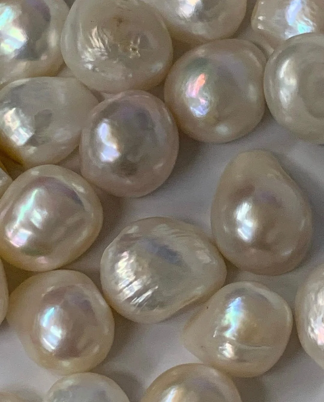 Pearls aren't just for your neck &ndash; they're for your home, too! 🐚  Incorporating pearl-inspired elements in your home adds a touch of sophistication, subtle shimmer, and timeless elegance. Think iridescent art or zellige tiles, pearl-toned fabr