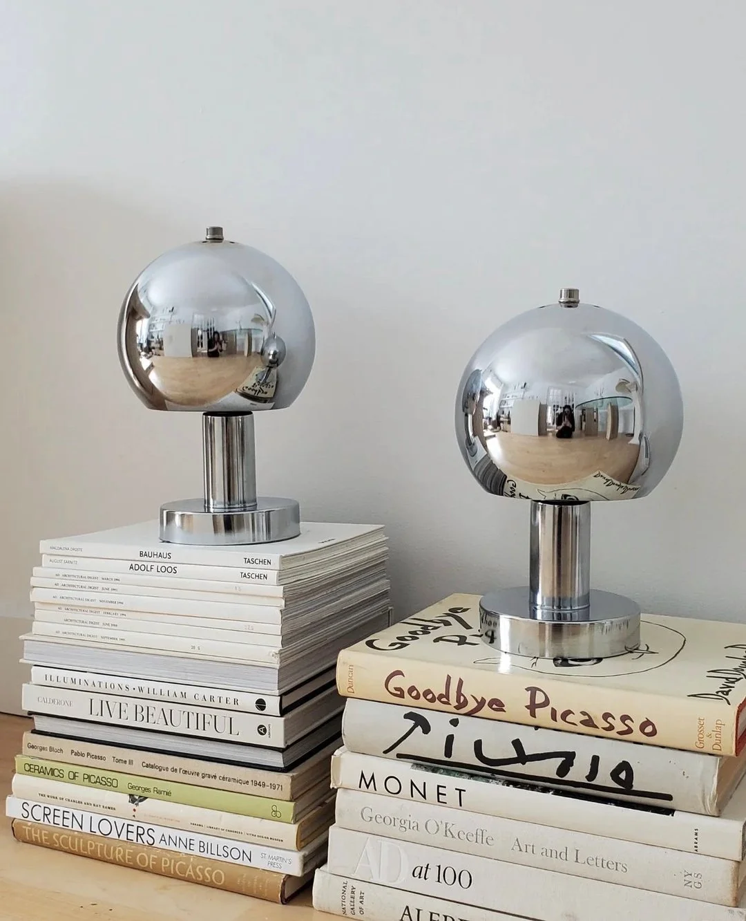 I just adore these chrome lamps and a good stack of books!