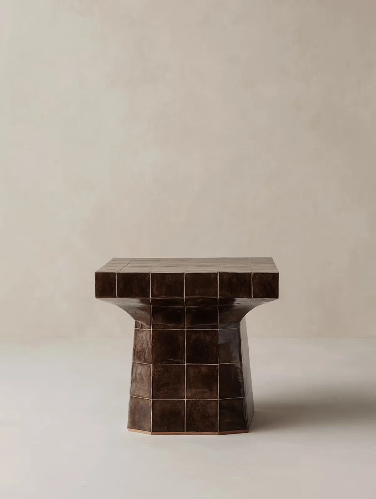 We love the rich chocolate brown of this side table. It&rsquo;s the mid century modernism influence that draws me in, especially the shape.