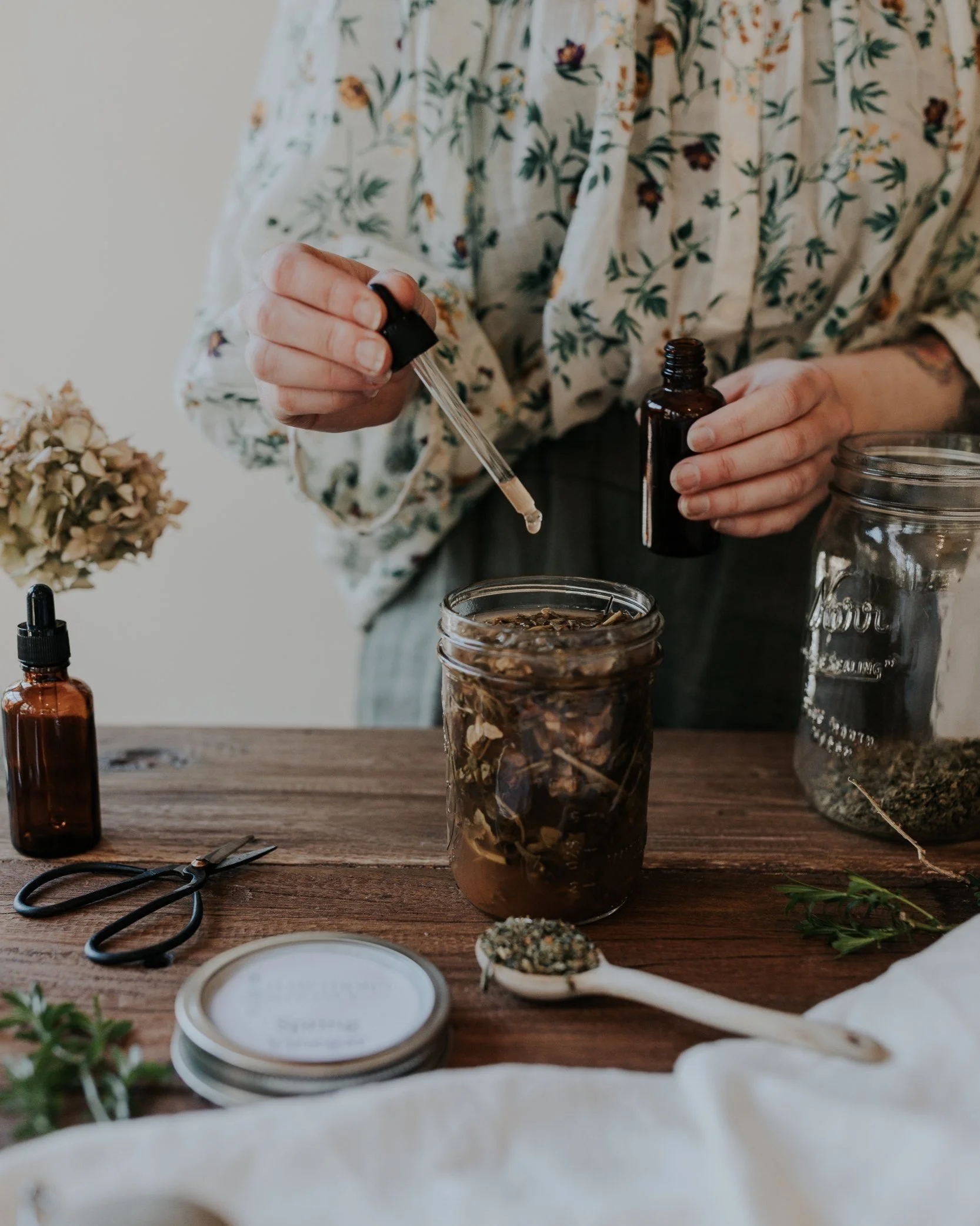 woman making herbal medicine