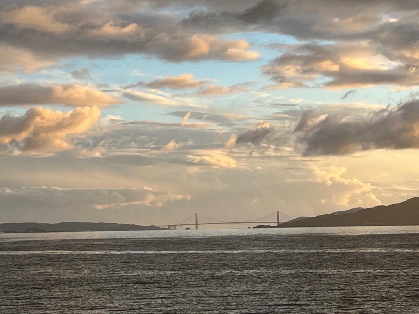 The mighty Golden Gate Bridge, eclipsed by nature.  @melissamanlove