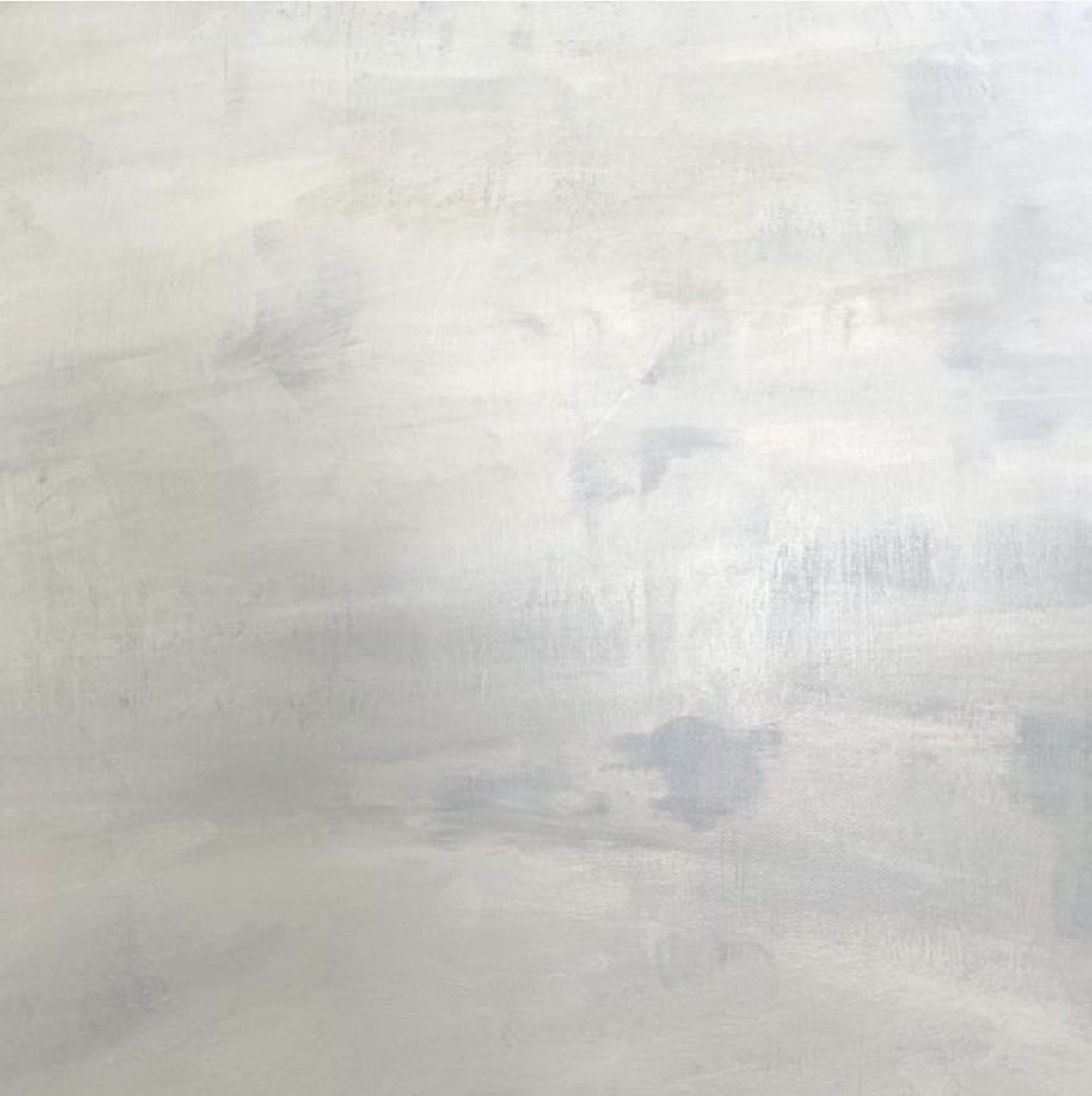 A plain, light-colored surface with some visible brushstrokes in a painterly texture.