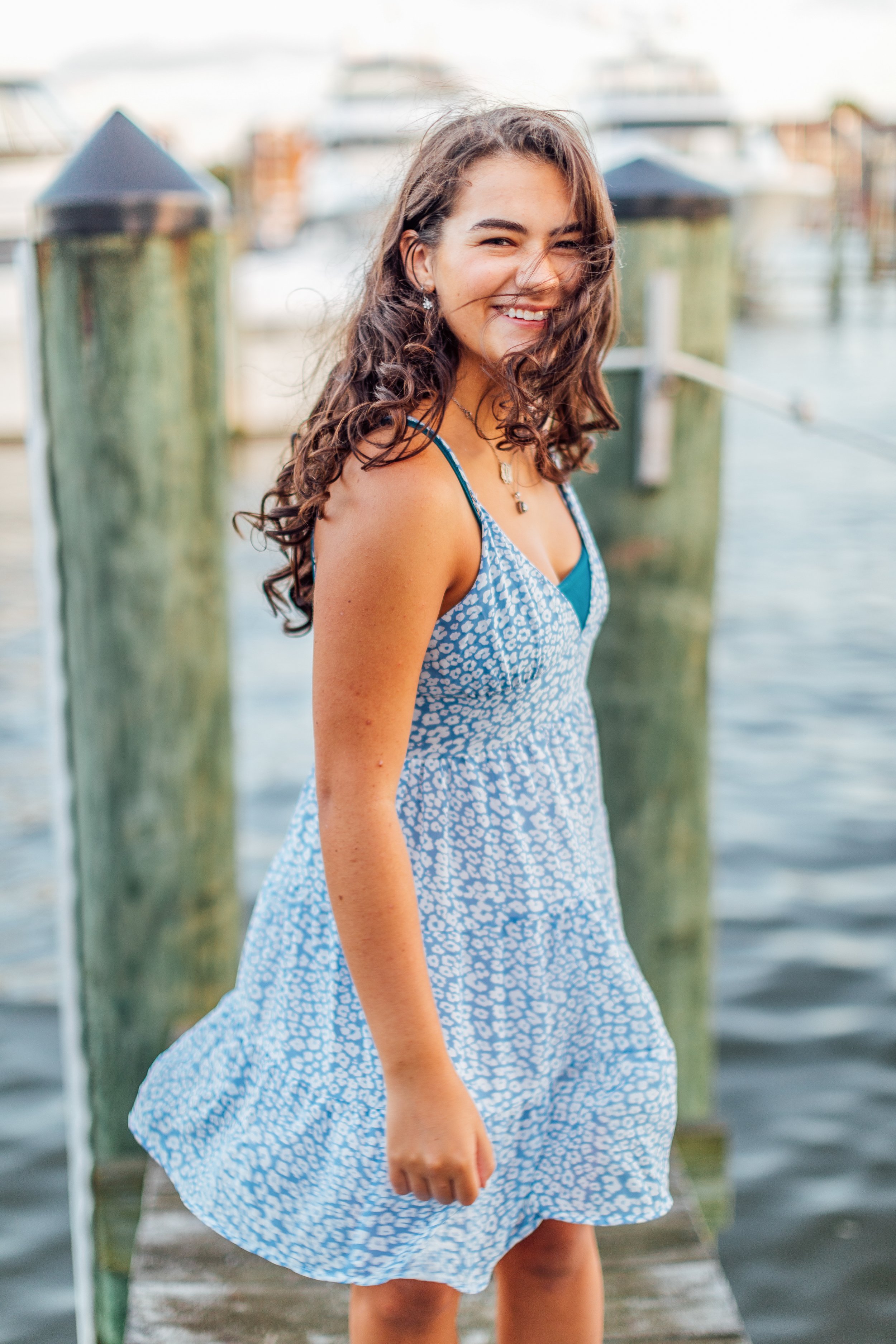 Heidi smiling on the dock in Downtown Annapolis for her senior pictures