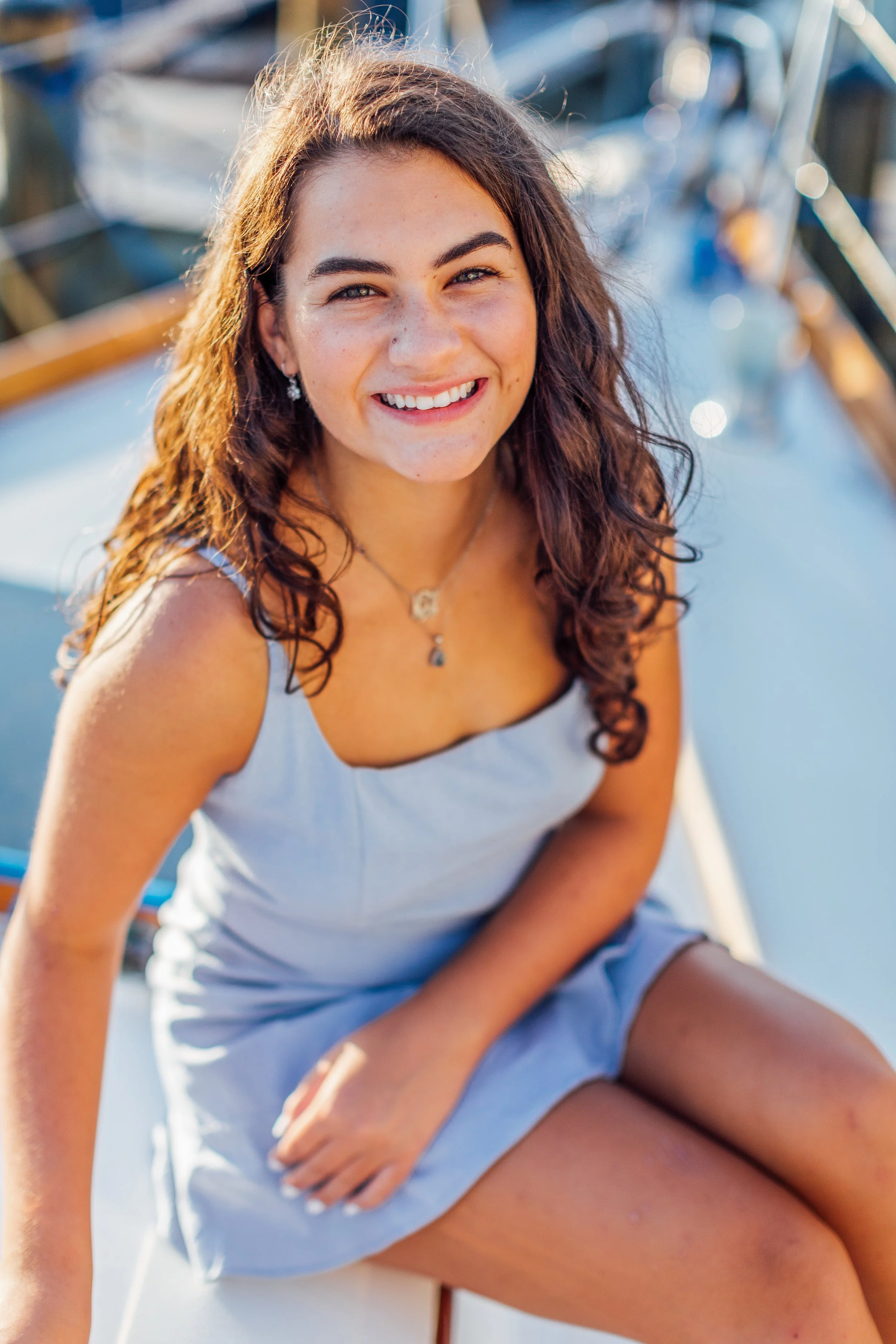 Senior photos on a sailboat in Annapolis Maryland.