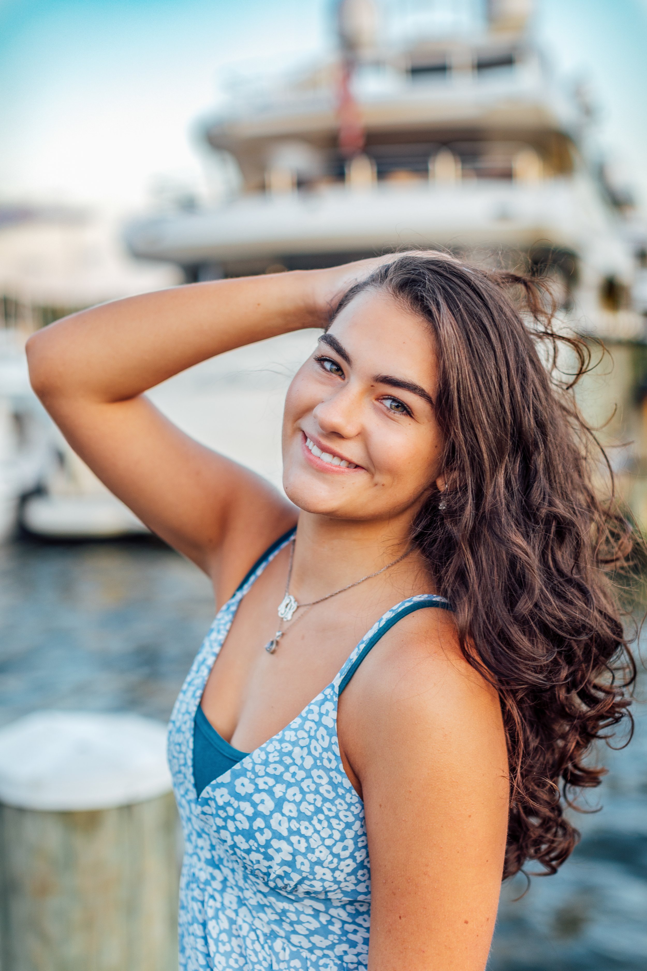Heidi smiling in a golden-hour senior portrait session in downtown Annapolis, Maryland